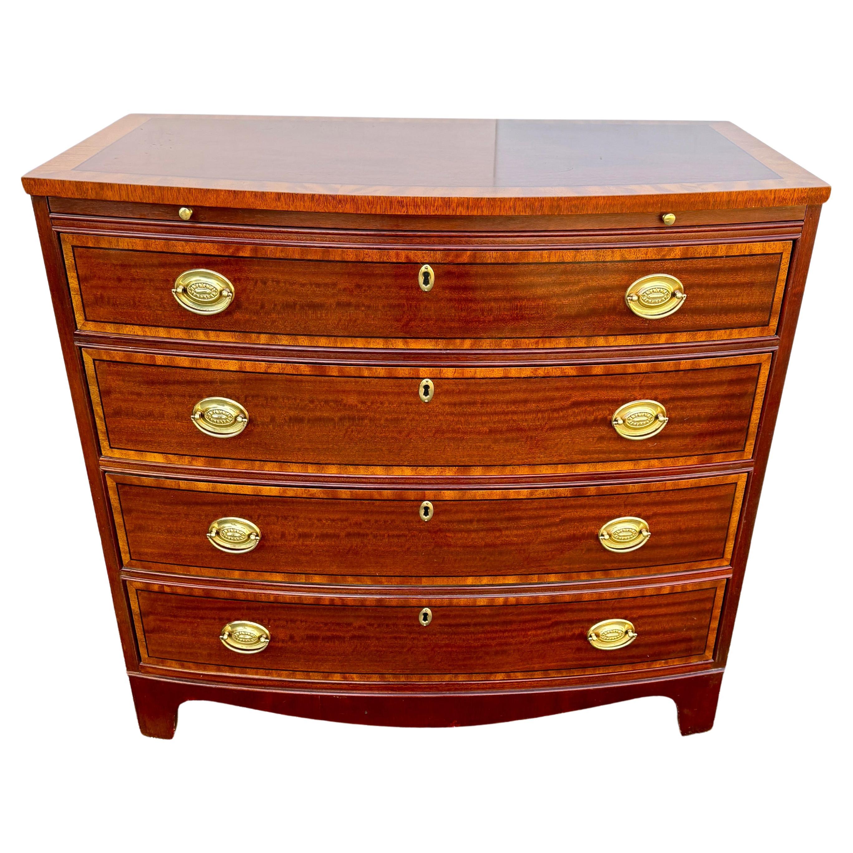 Baker Furniture banded inlay mahogany 4 drawers bow front chest. Satinwood drawer fronts have oval brass hardware. Pull out writing surface. Oak drawer construction.
Tri-State, DC and PA delivery before Christmas.