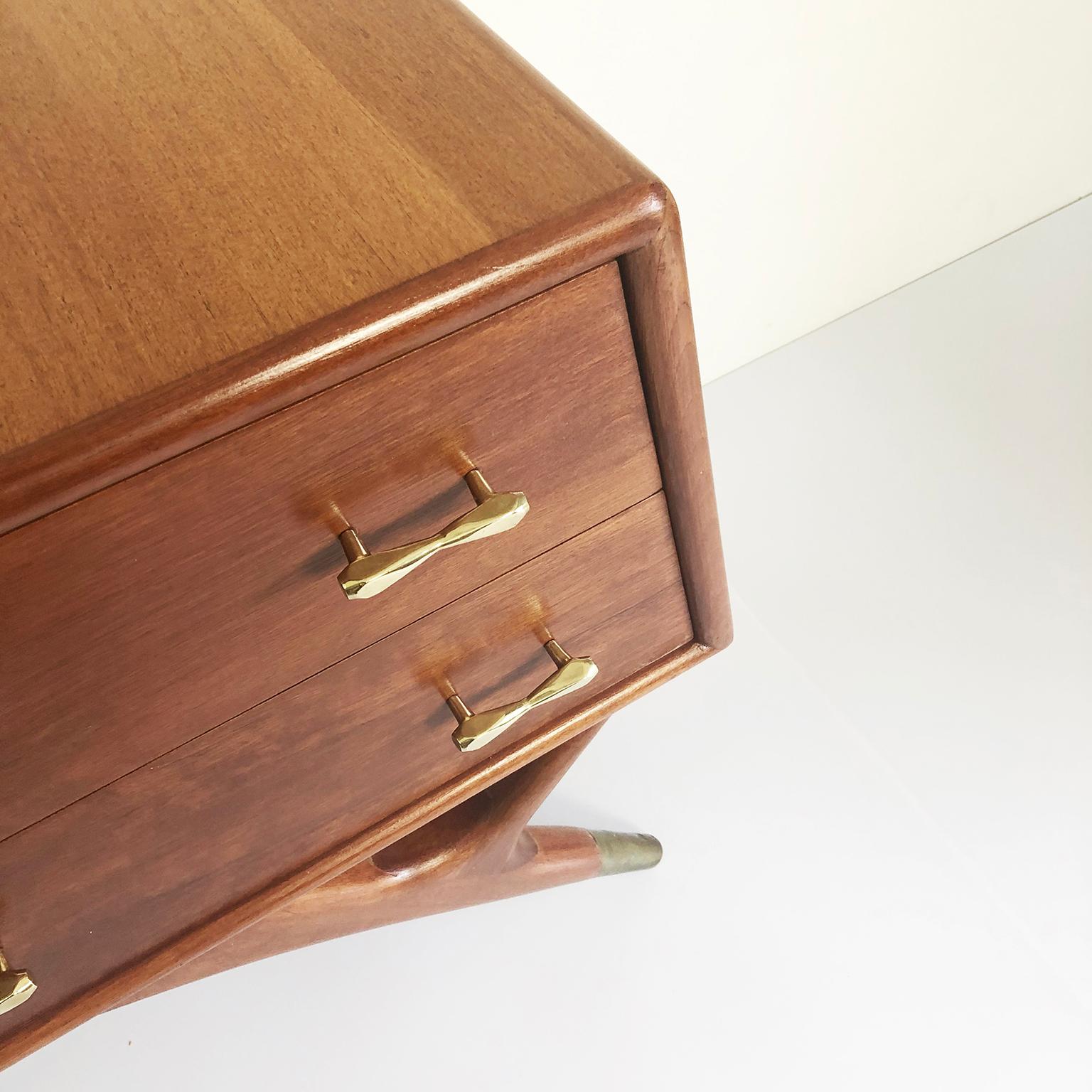 We offer this pair of mahogany and brass nightstands. Made in Mexico circa 1950s by Eugenio Escudero. Nightstands supported by sculptural leg in solid mahogany wood.