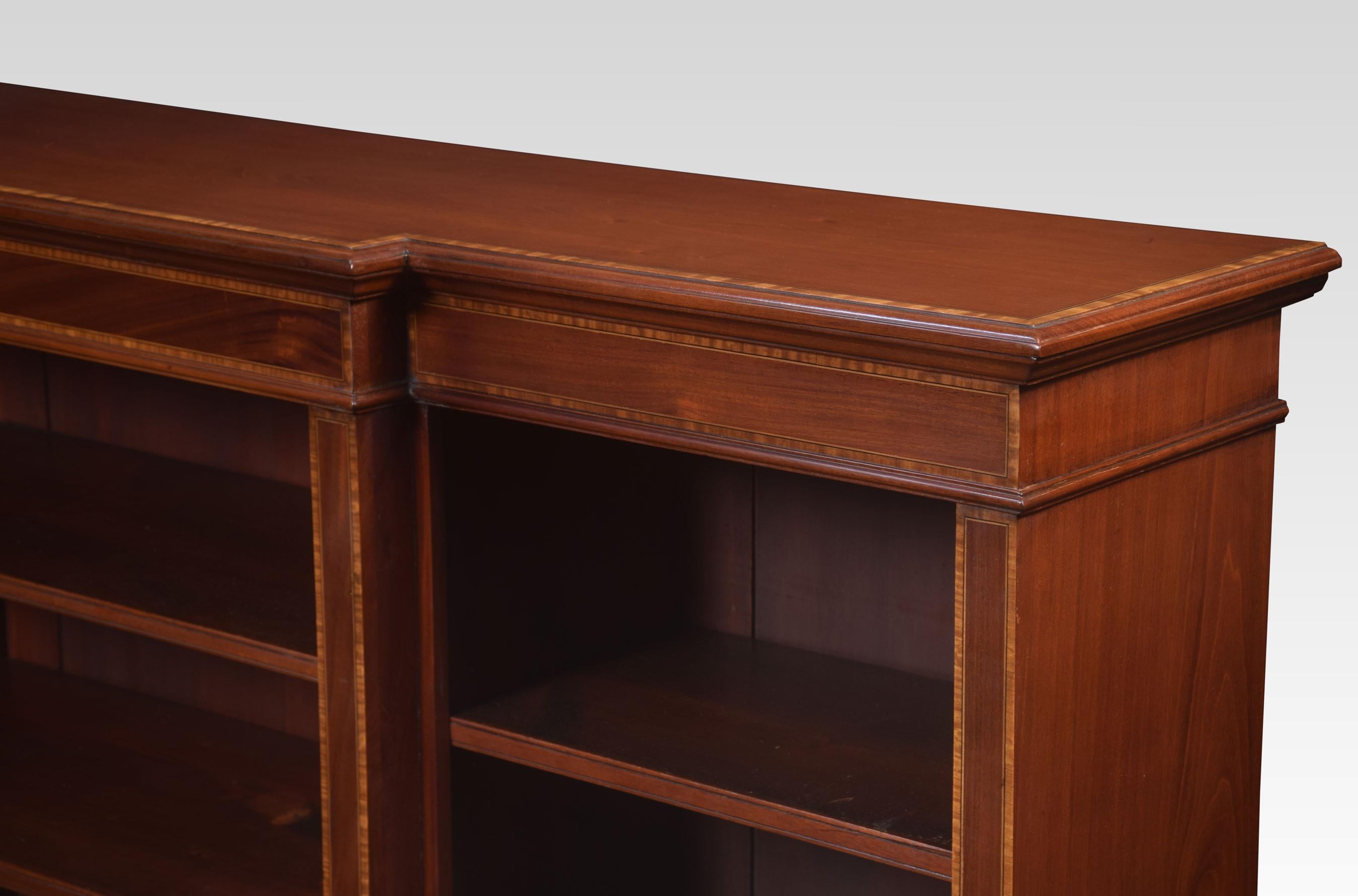 Mahogany bookcase, the rectangular breakfront top with satinwood inlaid border. Above three bays of adjustable shelves, all raised up on plinth base.
Dimensions:
Height 48 inches
Width 72 inches
Depth 15.5 inches.
