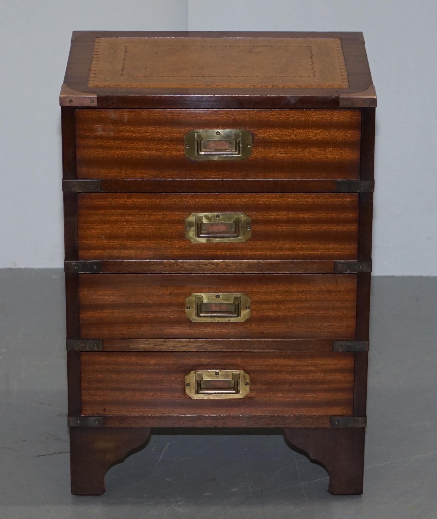 We are delighted to offer for sale this lovely vintage flamed mahogany, gold leaf embossed brown leather top with brass trim Military Campaign bedside lamp or wine table drawers

This is a very luxurious piece, the frame is flamed mahogany and has