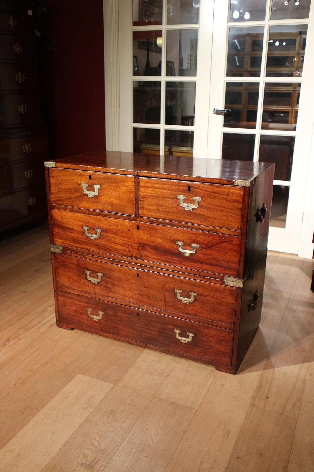 Antique mahogany campaign chest of drawers consisting of 2 parts. Beautiful warm weathered look and color. Special model drawer puller. Completely handmade with, among other things, handmade dovetail connections.
Origin: England
Period: Approx.