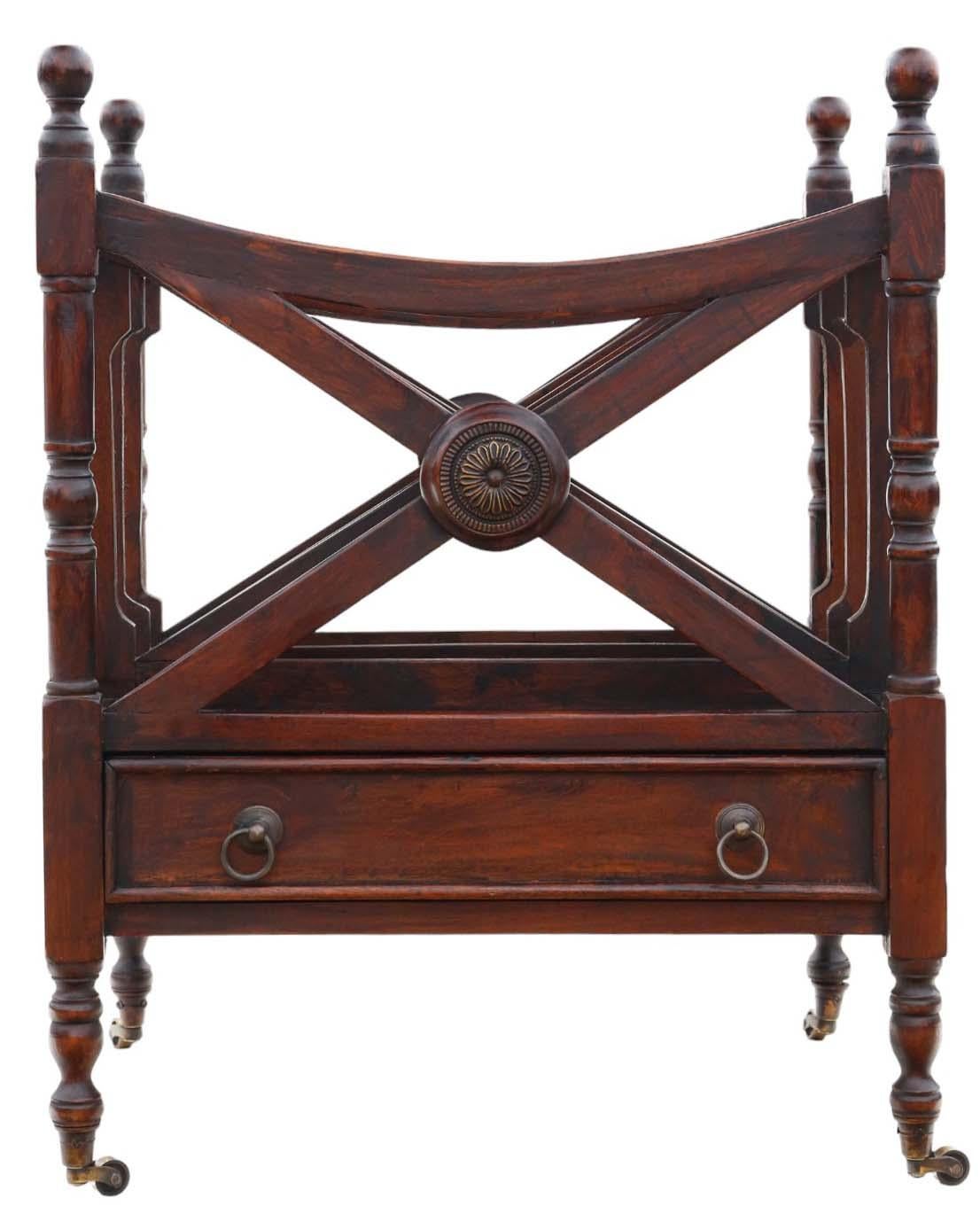 Introducing an interesting mid 20th Century Mahogany Canterbury Magazine Rack, boasting timeless elegance.

This charming piece is brimming with charm, and character, standing gracefully on castors.

Rest assured, there are no loose joints or