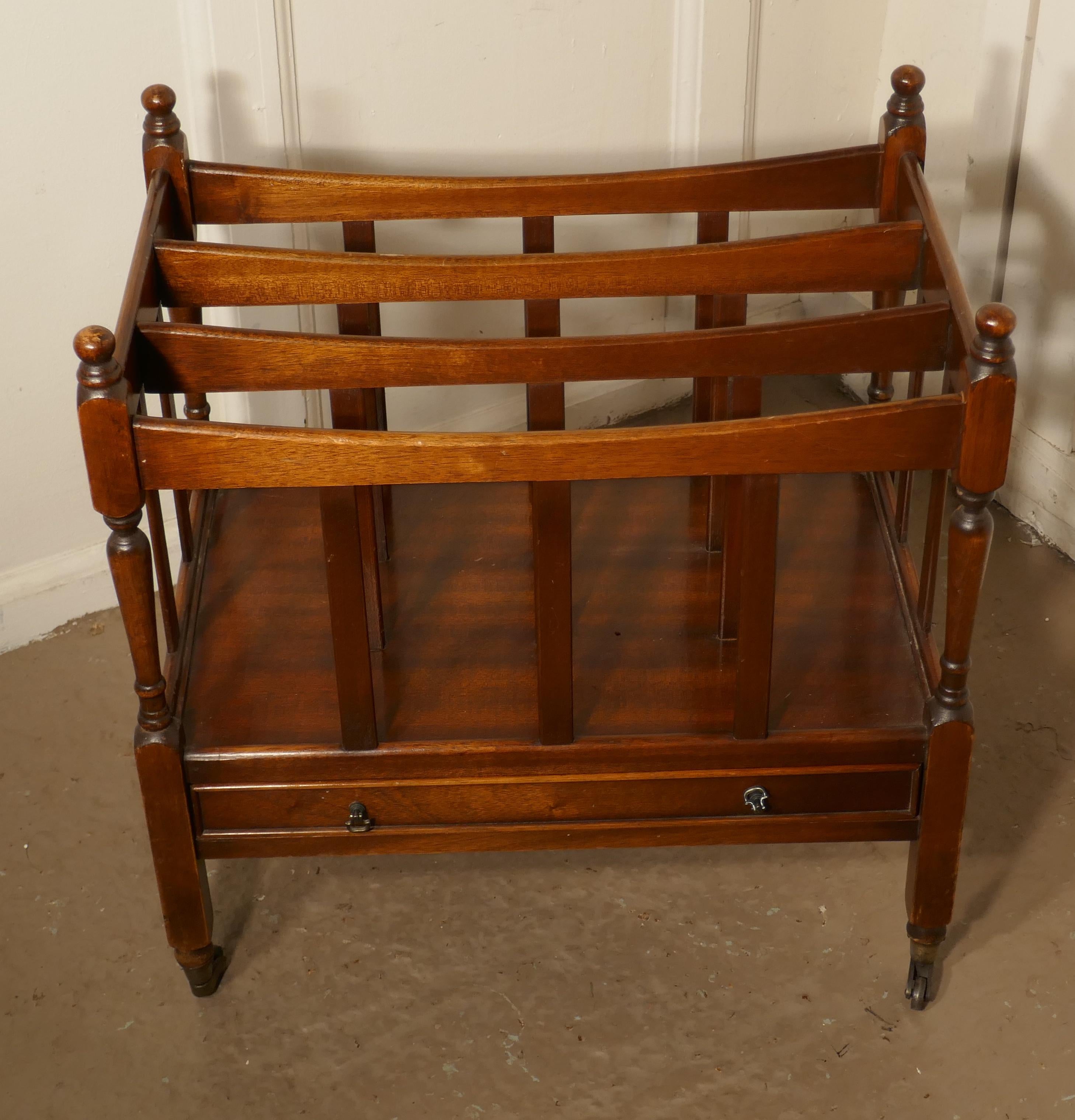 Mahogany Canterbury magazine stand

This is a pretty little piece, in mahogany, it stands on neat brass casters and has elegant turned uprights which end in crisply turned finials with 3 compartments and a long drawer at the bottom
An excellent