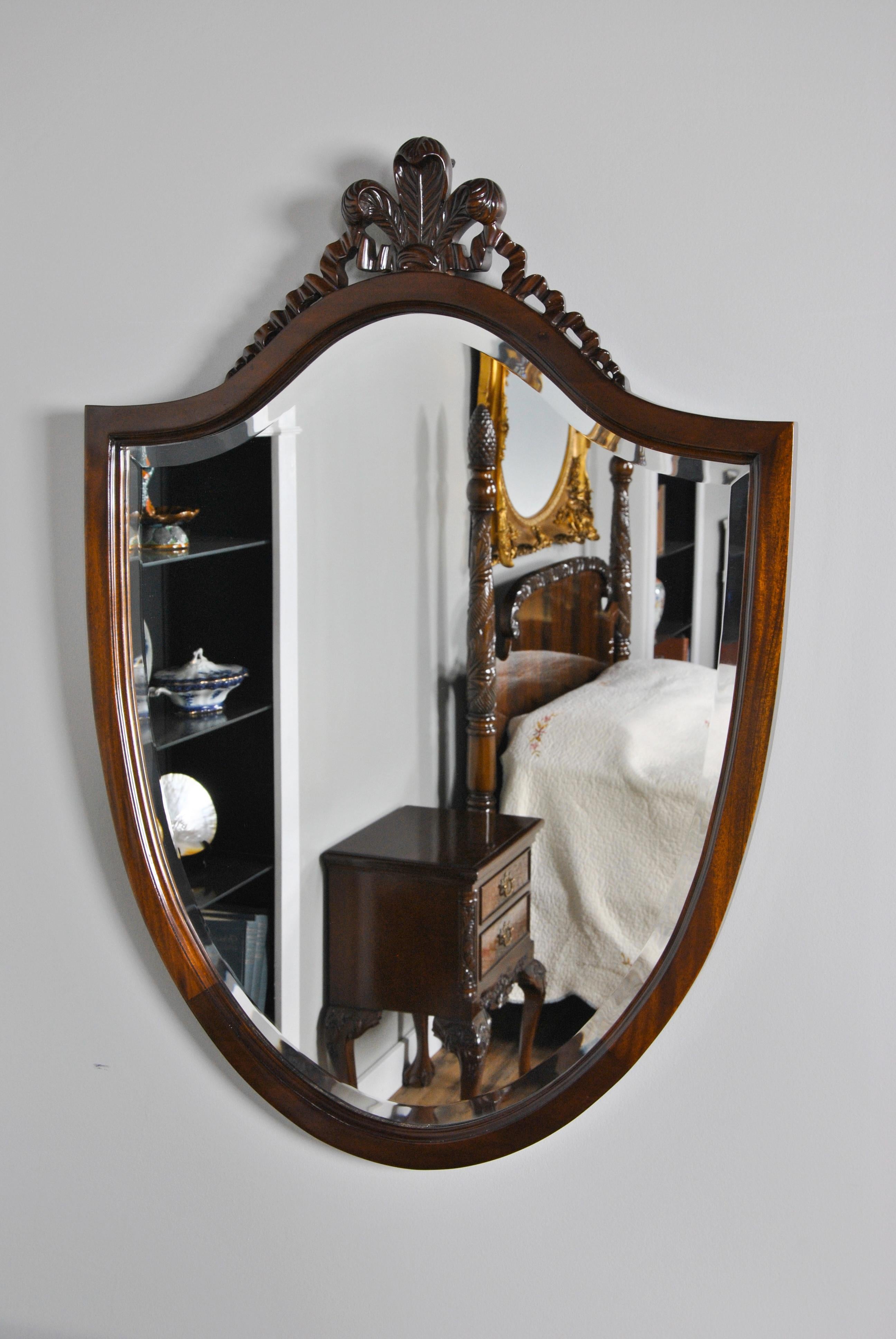 A solid Mahogany Carved Mirror with hand carving helps discern this piece from its' mass produced counter parts found in many other stores. Beautifully carved Fleur de Lis design is created by hand in solid mahogany, the mahogany coming from