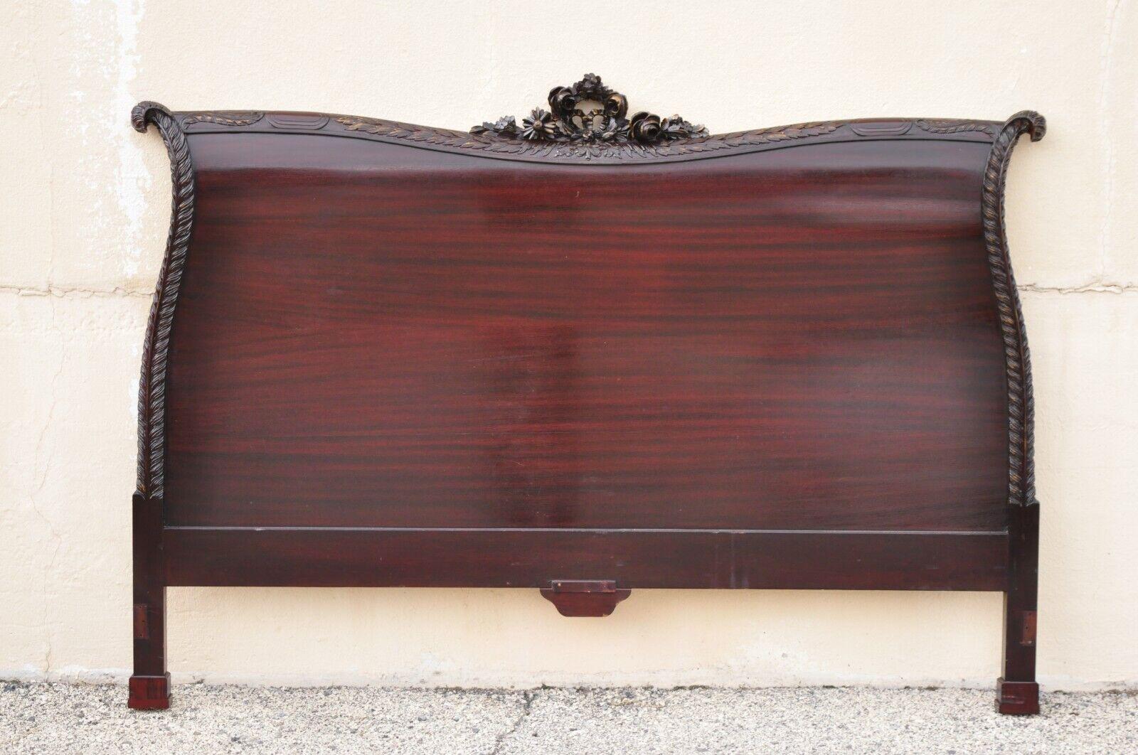 Mahogany carved plume feather prince of wales king size bed headboard. Item features finely carved plume details, floral carved pediment, beautiful wood grain, very nice vintage item, great style and form, does not include metal frame. Circa Early