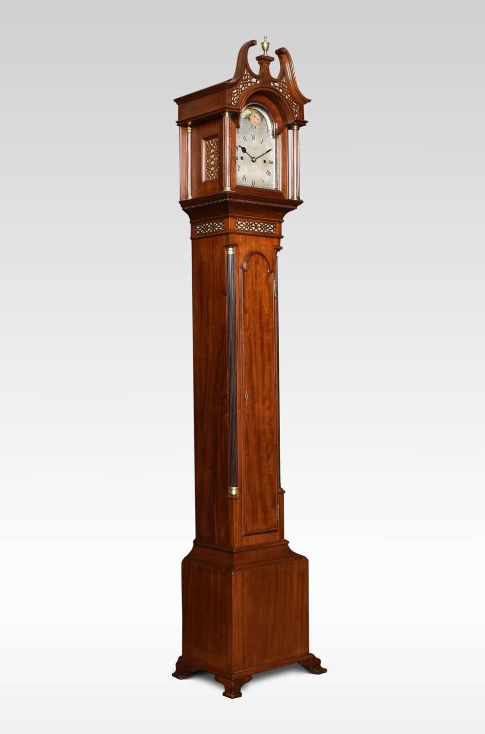 Mahogany cased grandmother clock by Hampton & Son Pall Mall, London, the eight day movement with anchor escapement and rack striking on a coiled gong. The painted rolling moon arch above the dial with foliate scrolls and Roman numerals. The hood