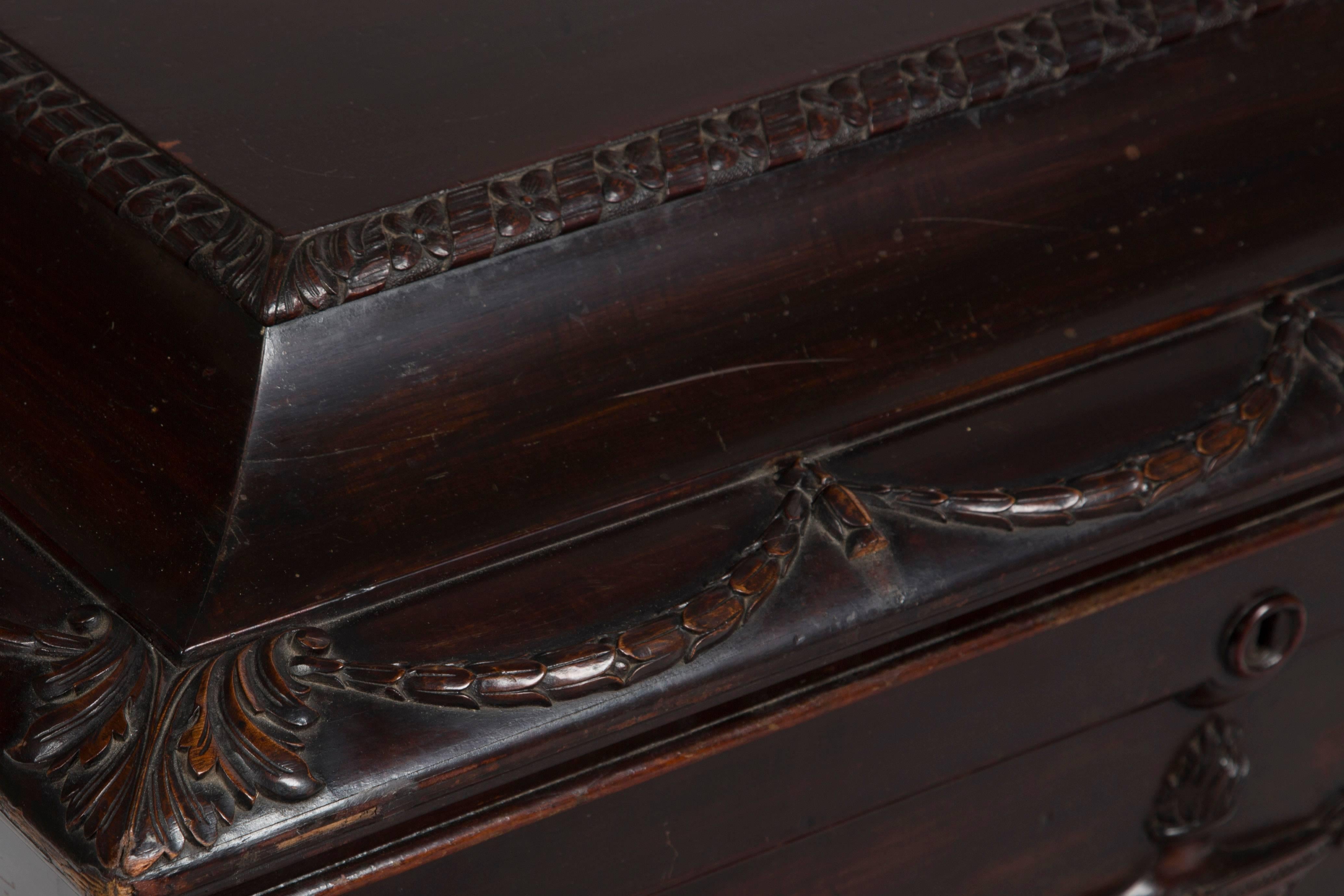 English Cellarette constructed in mahogany and corresponding veneers in an Adam revival sarcophagus form with hinged lid, probably retailed by Towser in the early 20th century.