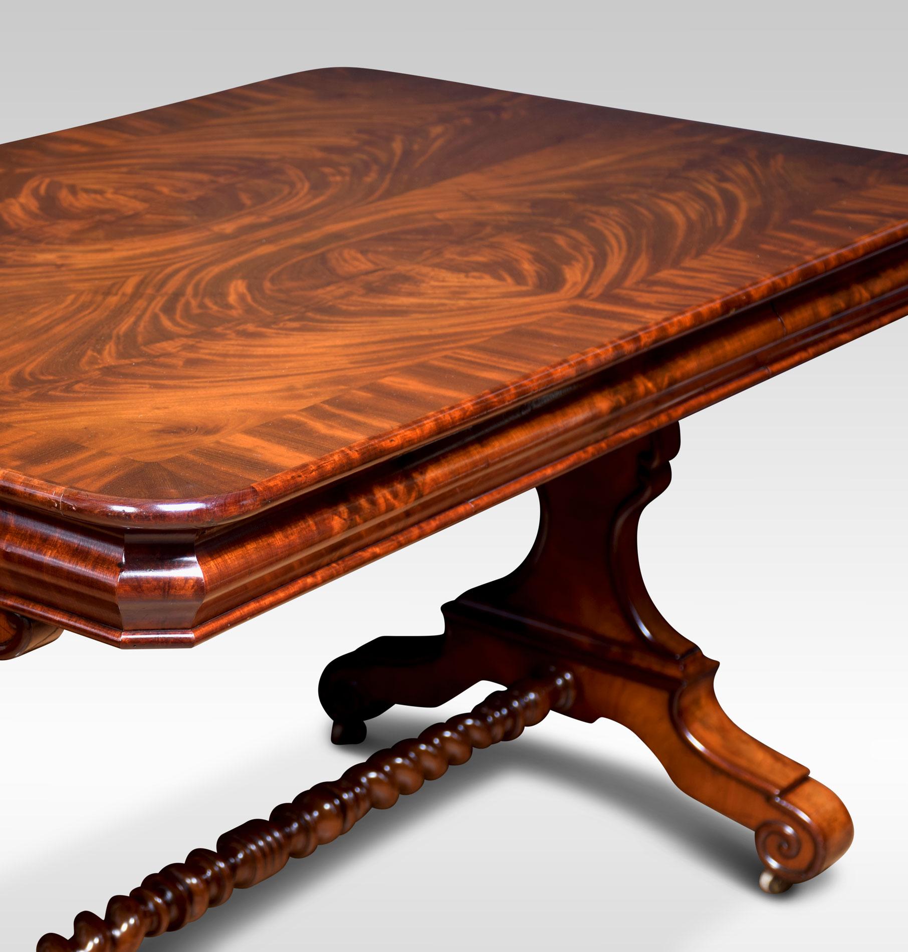 Mahogany writing table, the large rectangular figured mahogany crossbanded top above freeze drawer. All raised up on platform end supports terminating in scrolling feet and casters united by a barley twist stretcher.
Dimensions
Height 30.5