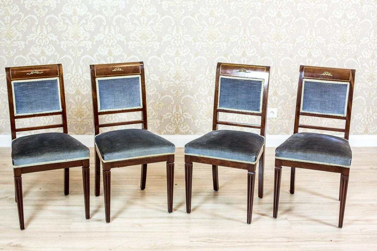 We present you these four antique chairs made of mahogany, with a softly upholstered seats and backrests.
The front legs are in the shape of a reversed pyramid; fluted on three sides.
The top rails of the backrests are slightly semicircular, with