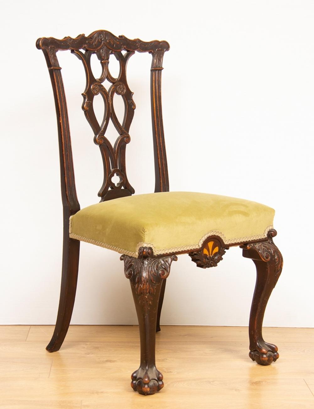 A pair of mahogany chairs with specimen wood inlay, circa 1860.
These chairs are very good quality mid-Victorian copies of a Chippendale period chair.
     