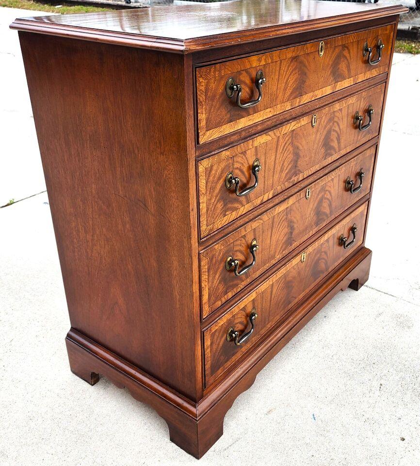 For FULL item description click on CONTINUE READING at the bottom of this page.

Offering One Of Our Recent Palm Beach Estate Fine Furniture Acquisitions Of A
Flame Mahogany Chest Dresser in the English Georgian Style by Hickory Chair