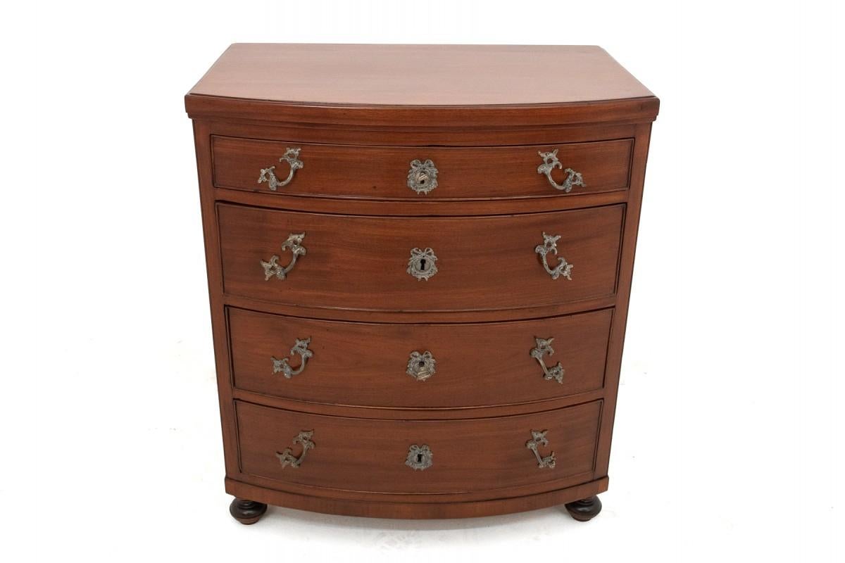 The mahogany chest of drawers comes from Northern Europe from the late 19th century. Four deep lockable drawers. Very good condition, renovated in our workshop.

Dimensions:

Height: 79cm

Width: 69cm

Depth: 47cm