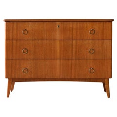 Mahogany chest of drawers with gilded handles