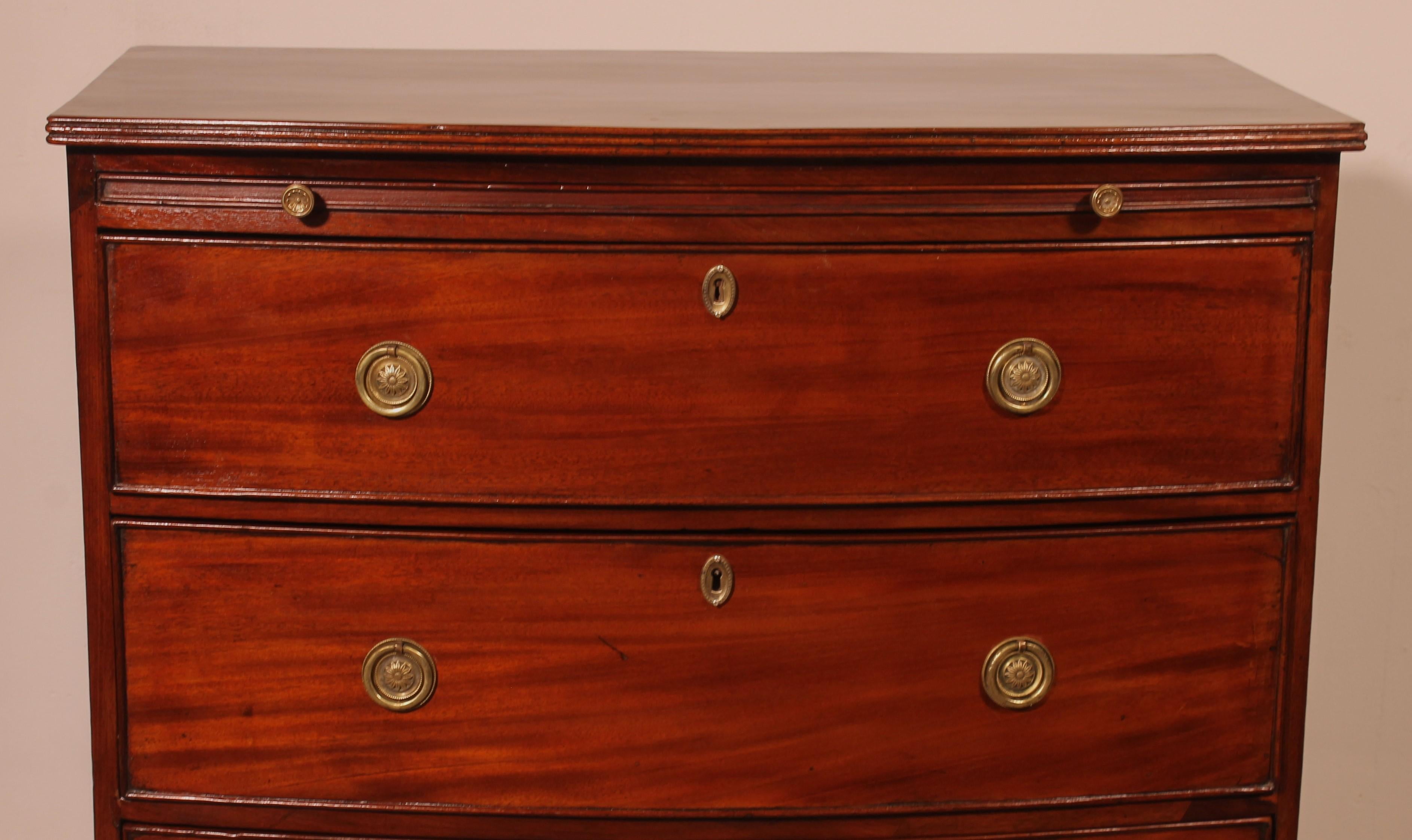 a fine bowfront mahogany chest of drawers circa 1800
English chest with a writing table below the top
The writing table is a sign that the chest of drawers is from the end of the 18th century - beginning of the 19th century since this was no longer