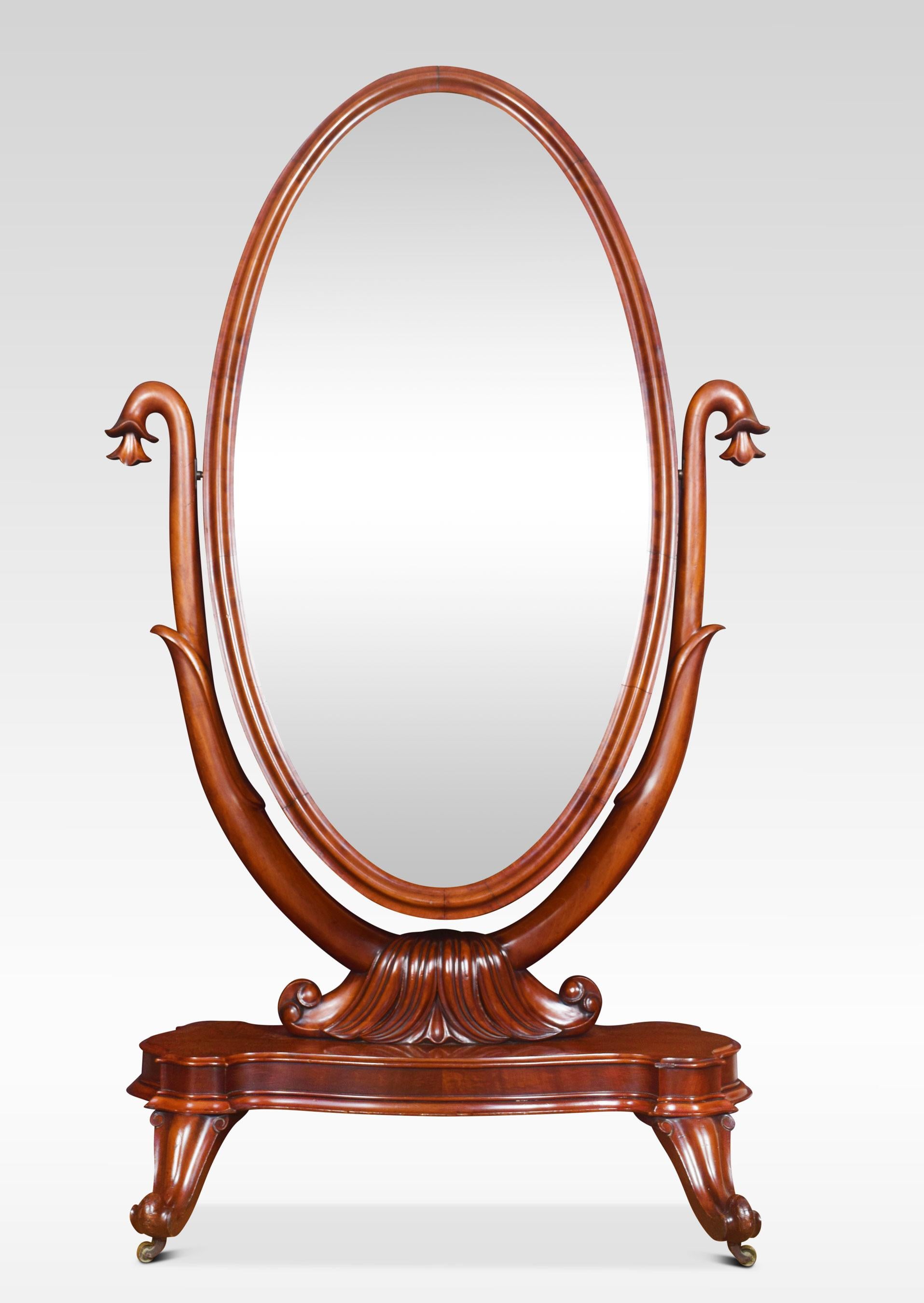 Victorian mahogany cheval mirror the moulded frame enclosing the adjustable oval mirror plate flanked by scrolling supports. All raised up a stepped base and down swept legs terminating in brass castors.
Dimensions
Height 68.5 inches
Width 39.5