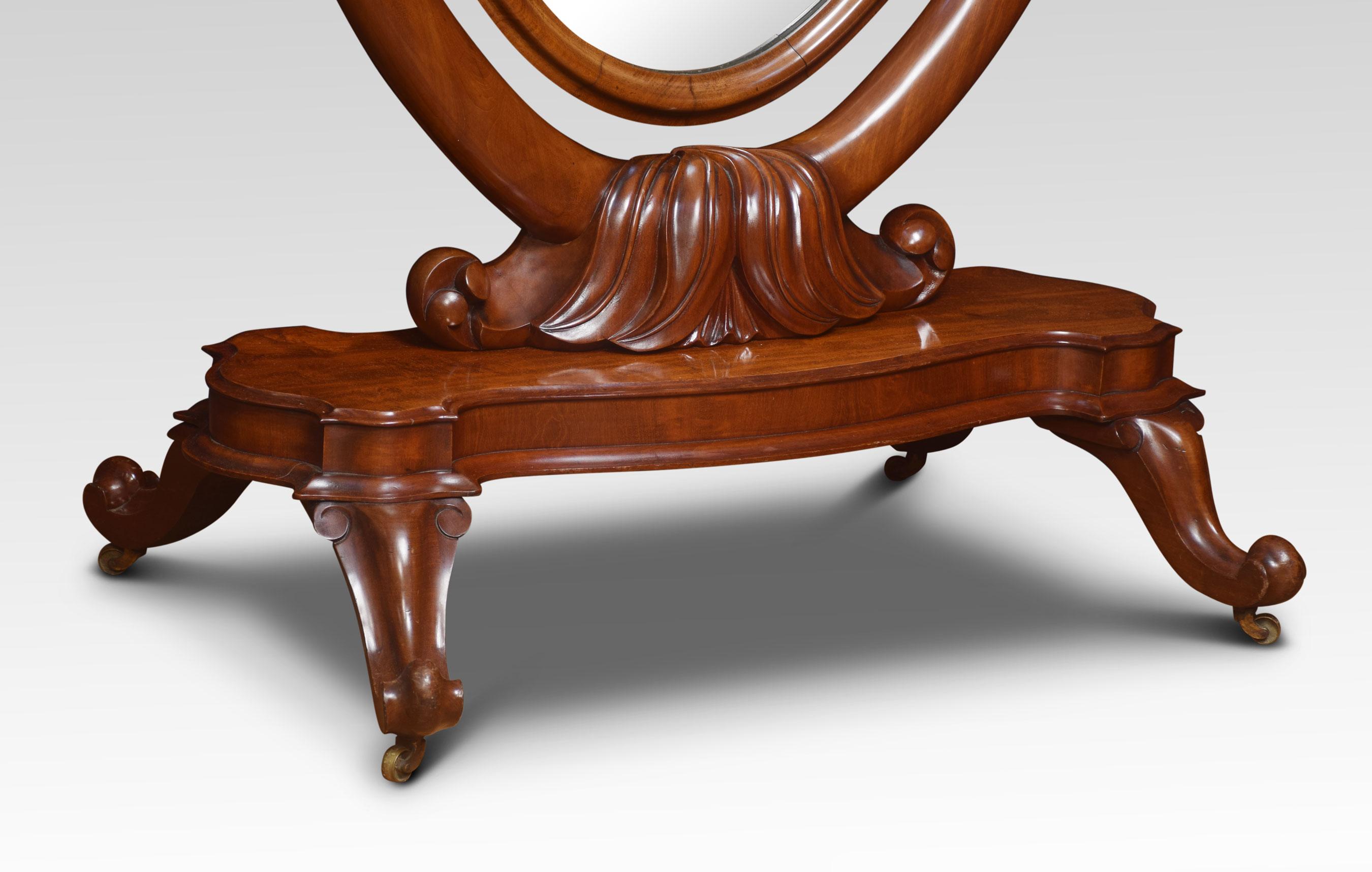 19th century mahogany cheval mirror the molded frame enclosing the adjustable oval mirror plate flanked by scrolling supports. All raised up a stepped base and down swept legs terminating in brass castors.
Dimensions
Height 68.5 inches
Width 41