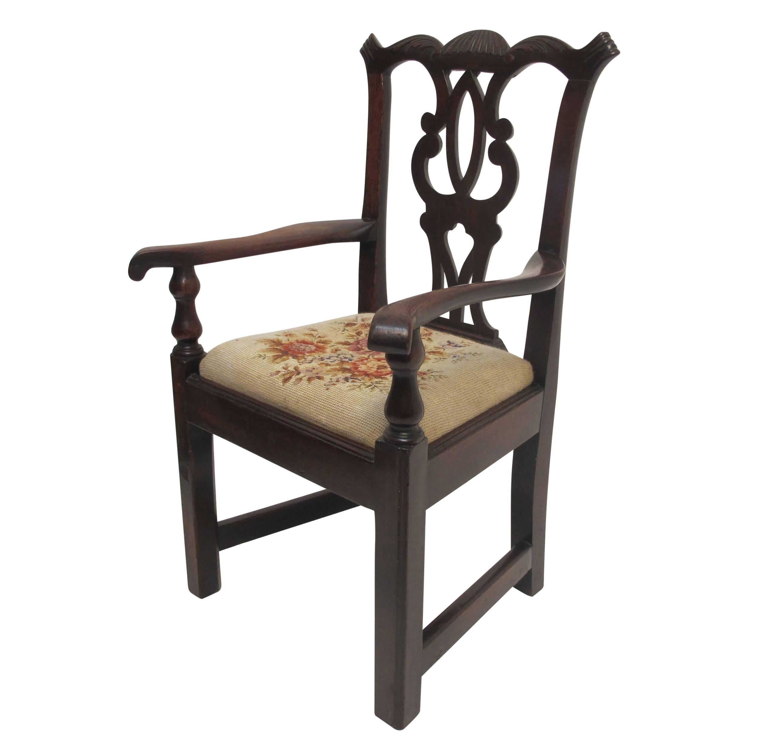 A miniature to scale mahogany Chippendale chair with needlepoint seat. Child size chair or possibly an apprentice or cabinet makers sample, England, 19th century.