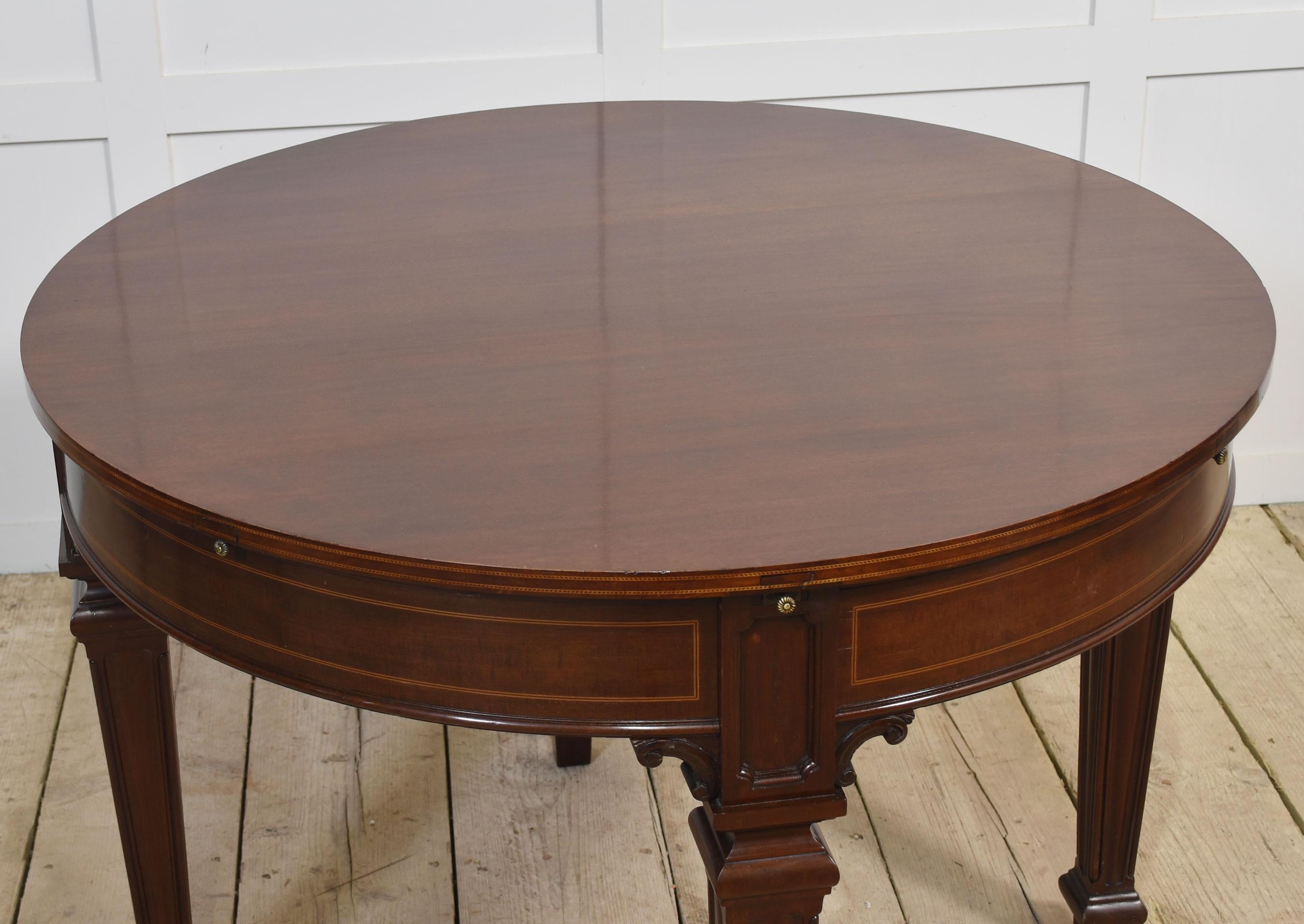 Wood Mahogany circular extending dining table For Sale