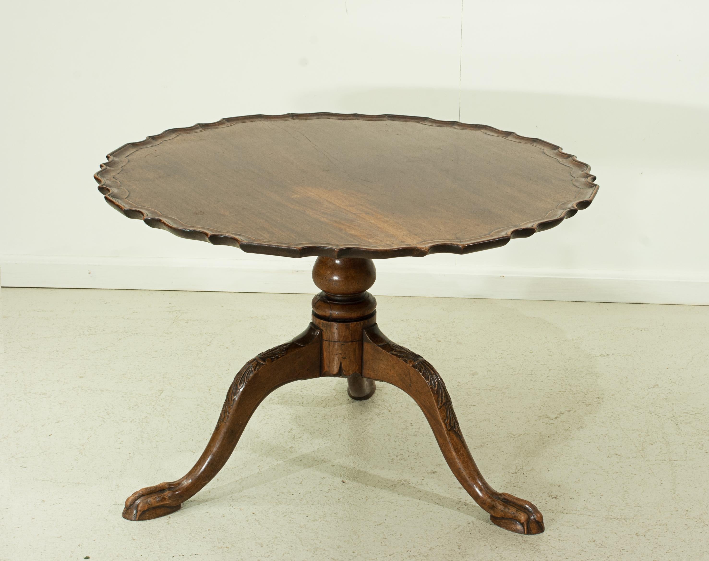 Tilt-top tripod mahogany table.
A good quality mahogany tilt top, occasional table with a pie crust top. Mounted on a turned column with a tripod base with carved legs terminating with a claw foot. The table has been reduced in height to be used as