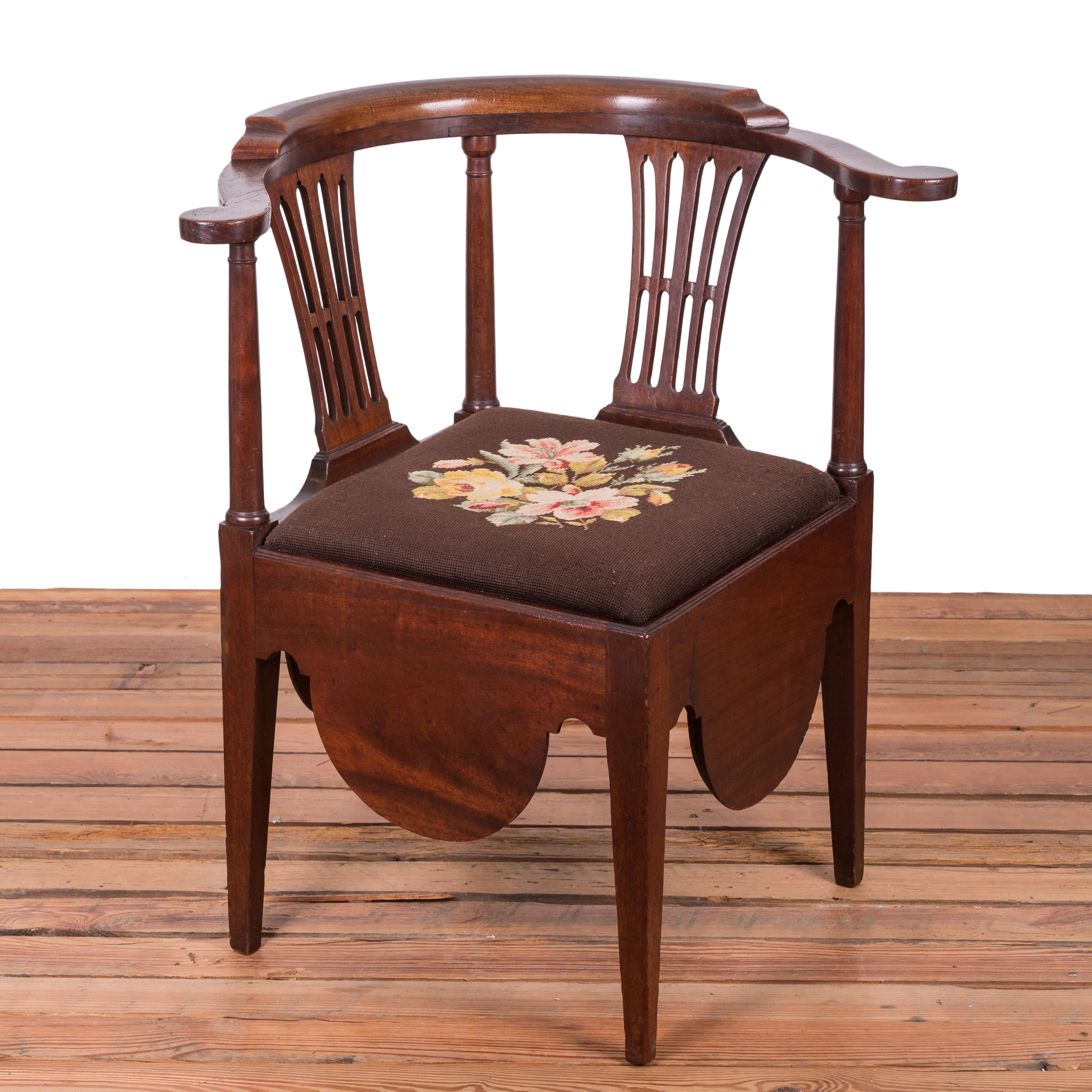 A mahogany corner necessary chair with needlepoint seat, late 18th century.



28 ¾ inches wide by 26 inches deep by 31 inches tall

seat height 18 inches





