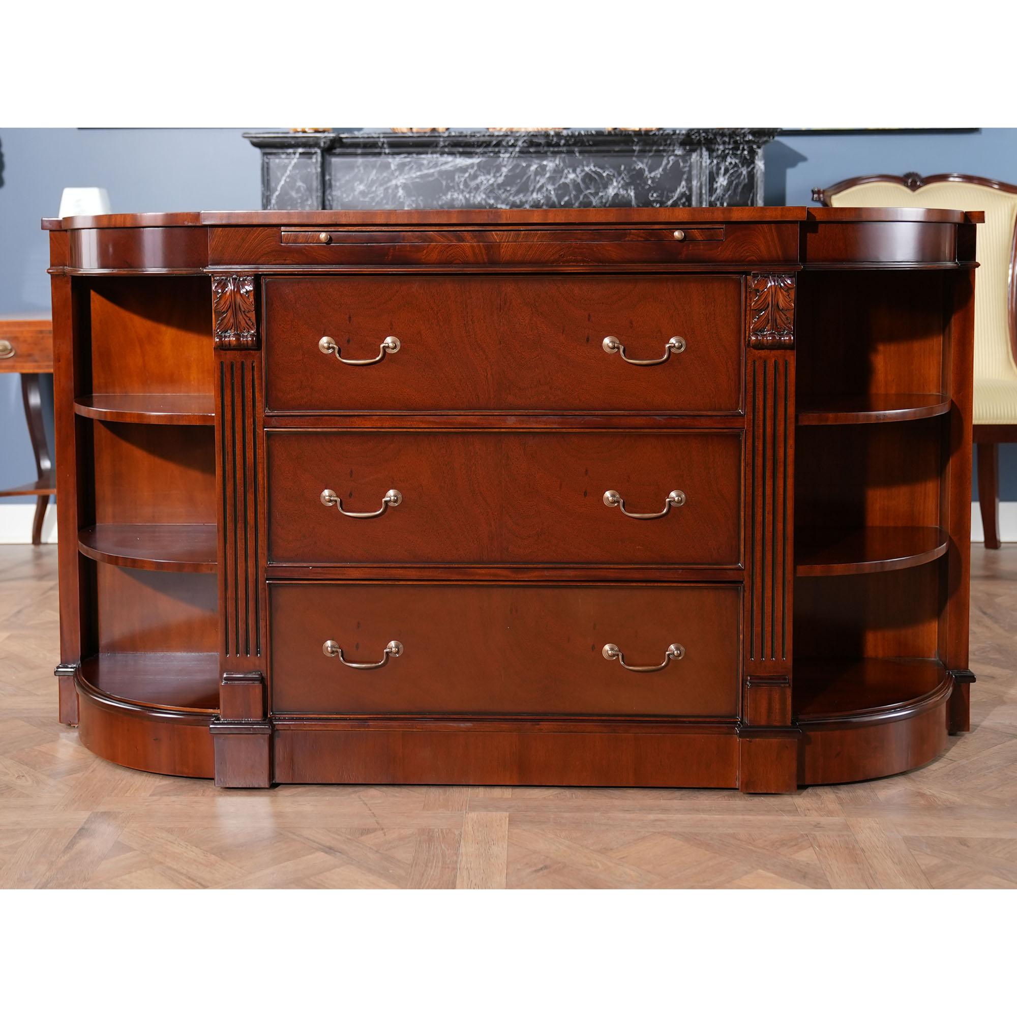 The Niagara Furniture Mahogany Credenza with Pullout Slide. This stylish piece has fantastic details throughout; including a genuine full grain leather inset pull out tray, beautiful, solid brass drawer pulls, hand carved solid mahogany carvings and
