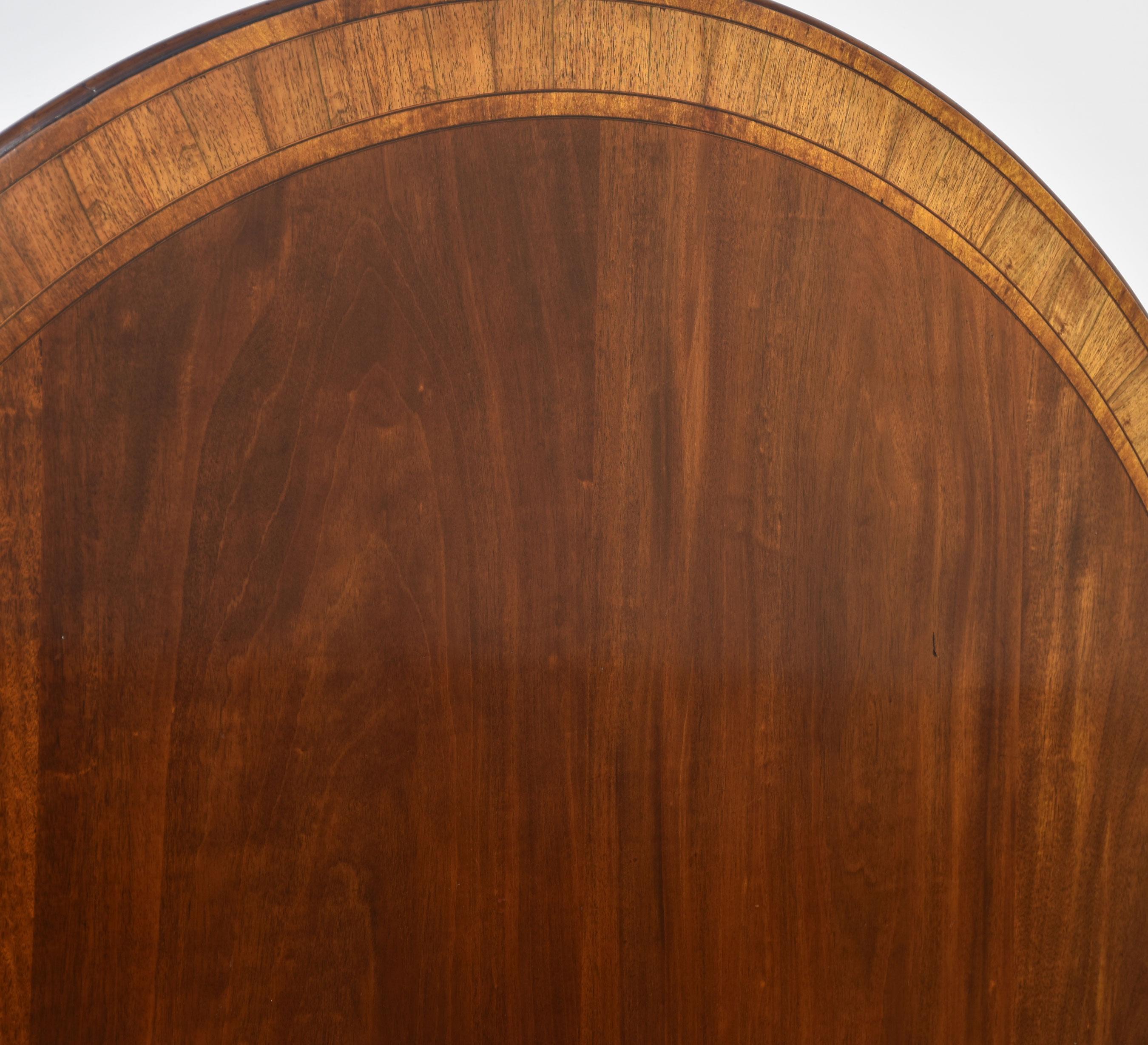 British Mahogany cross banded circular dining table