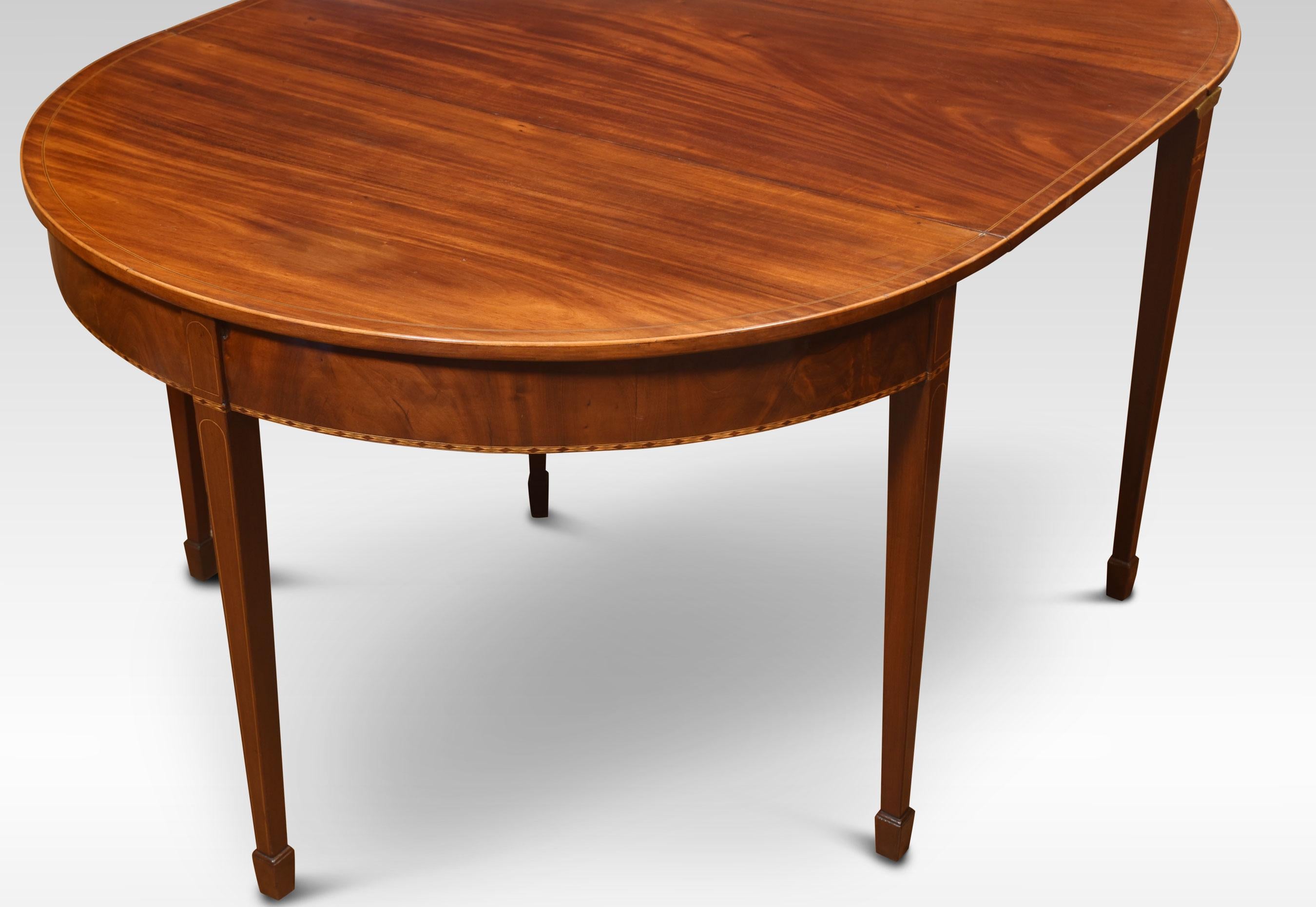 Mahogany inlaid demi-lune dining table or side tables, each with ebony and satinwood stringing, chequered frieze and raised on squared tapered supports and spade feet. One table with rectangular fall flap joining the two.
Dimensions
Height 28.5