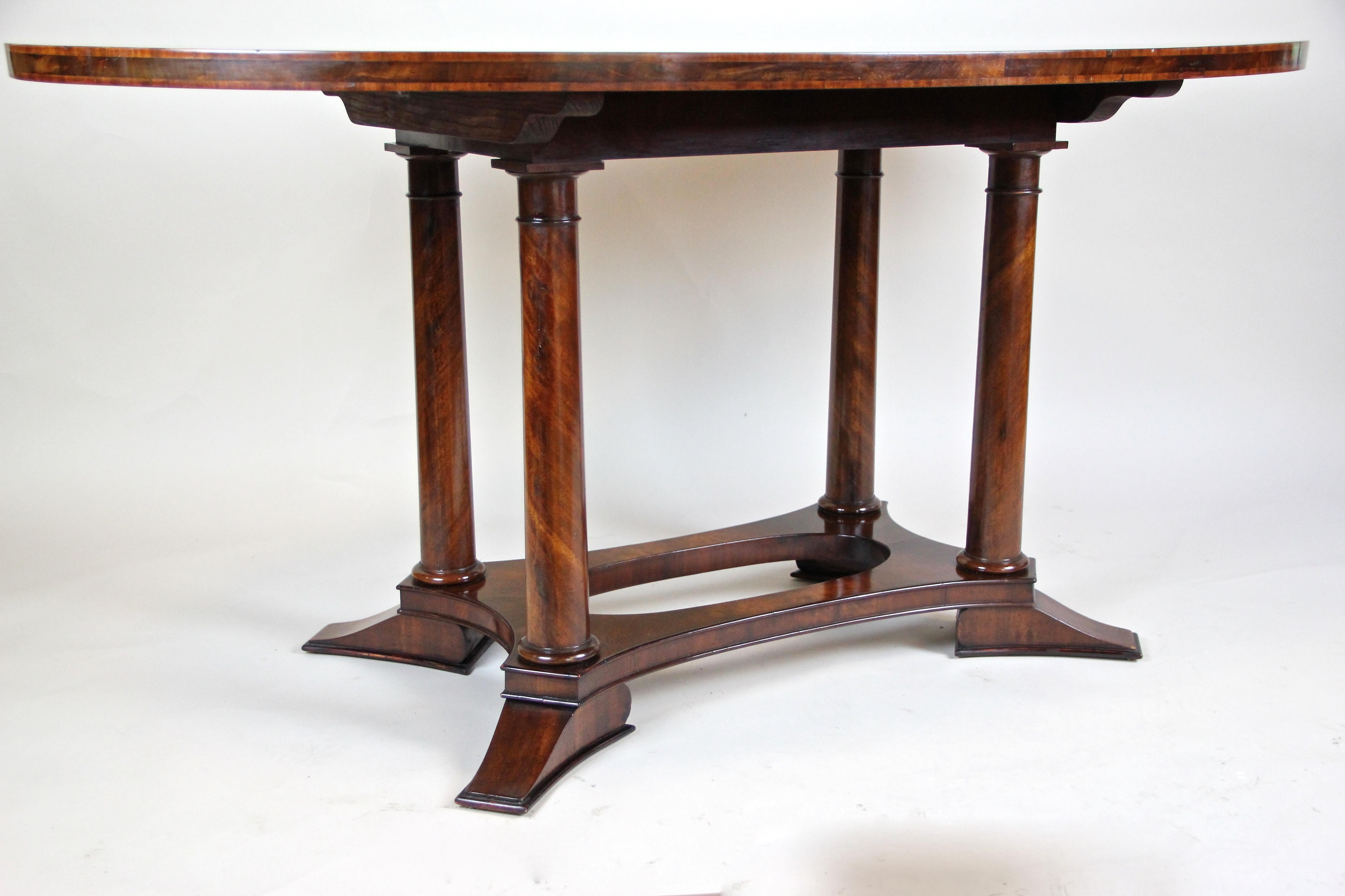Wonderful Biedermeier mahogany dining table from Austria. Made with attention to details, this table from circa 1840 comes with a timeless shape, veneered in fine mahogany. Not only the oval top plate impresses with its great mirror matched grain