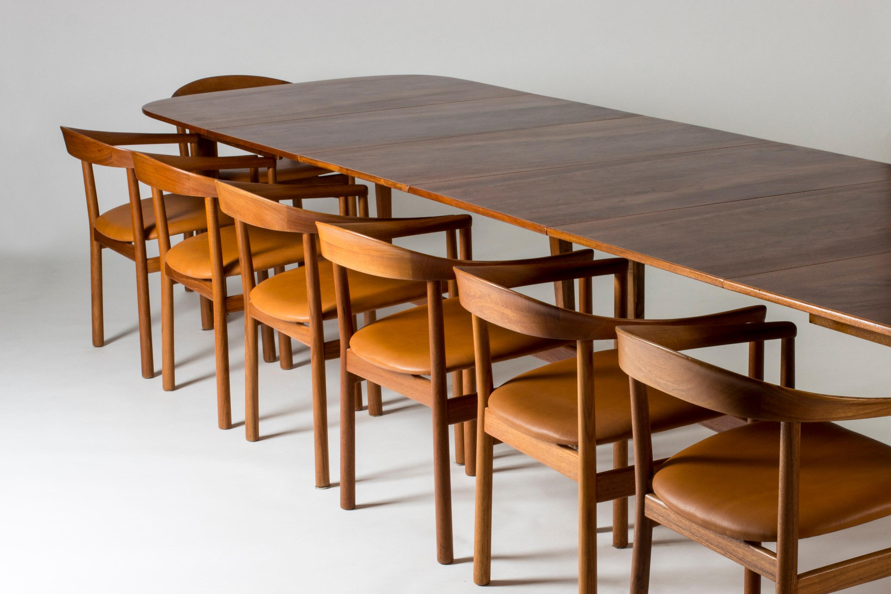Amazing dining table by Josef Frank, made from beautiful mahogany. Rounded corners with an elegant inlaid line around the edge. The table has four extension leaves and seats fourteen people when fully extended. When three or four leaves are added,