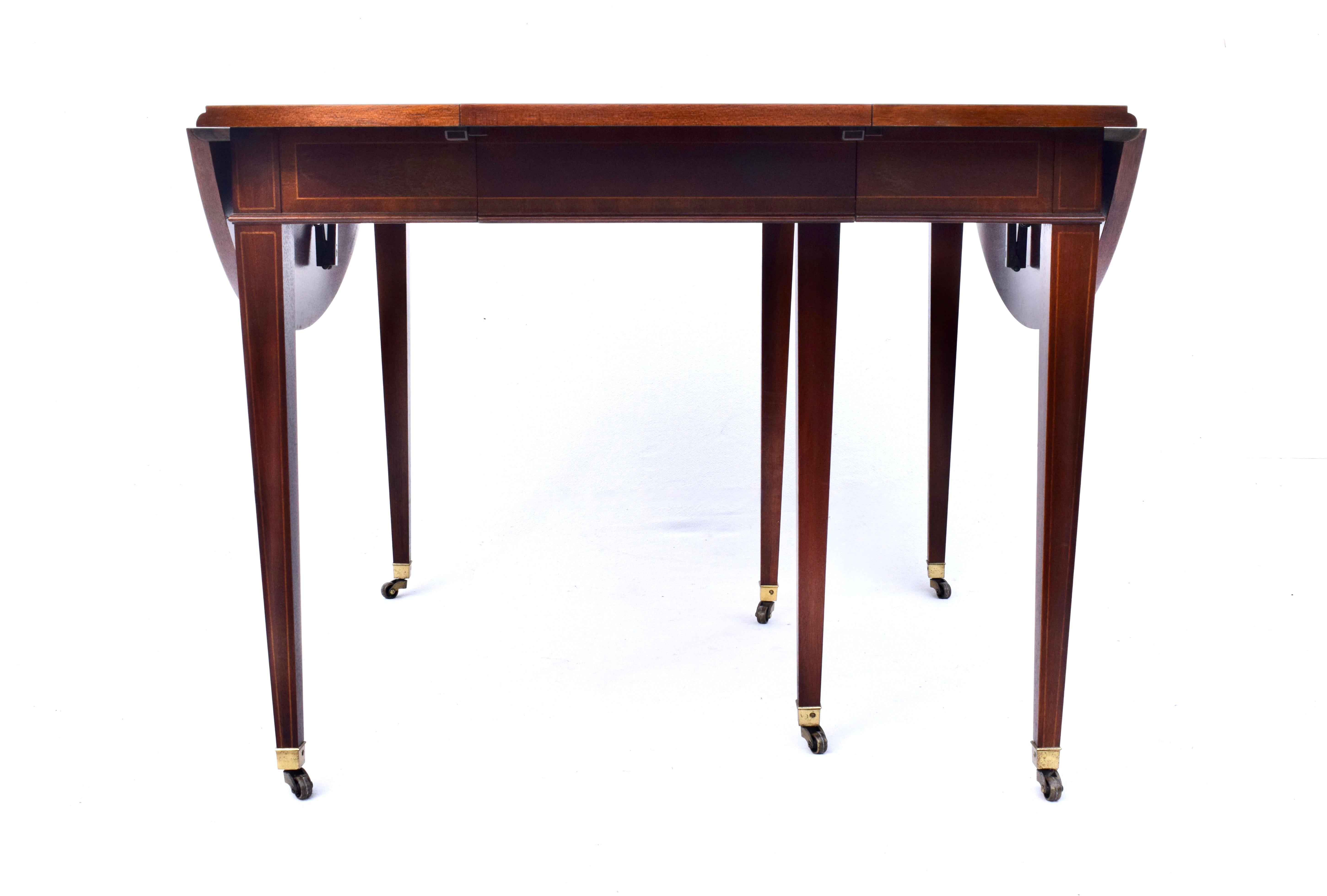 Mid-20th Century Mahogany Dining Table With Drop Leaf Option by Baker Furniture For Sale