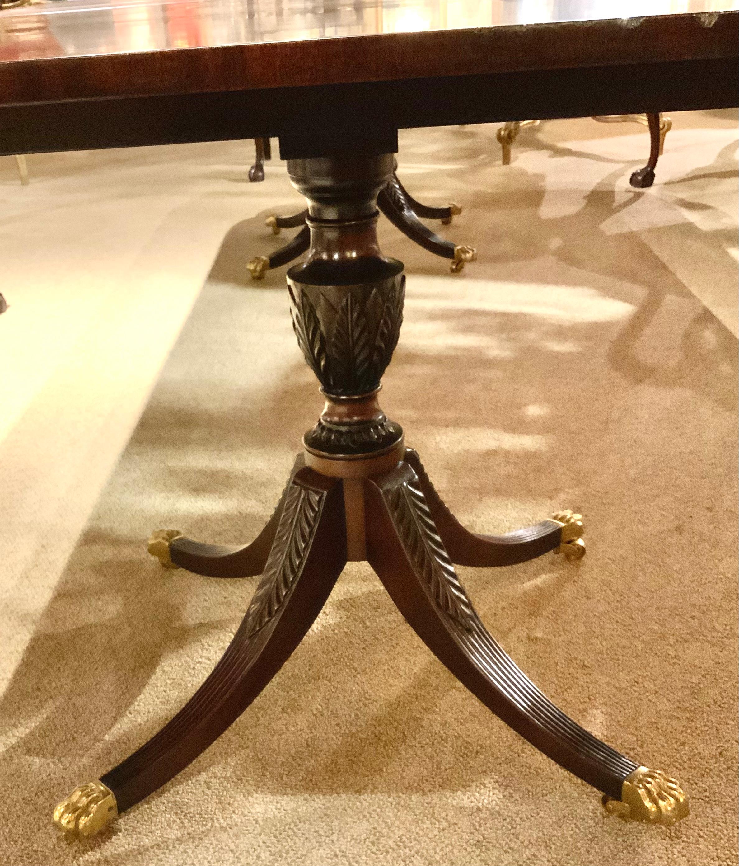 20th Century Mahogany double pedestal george III - style dining table with four leaves