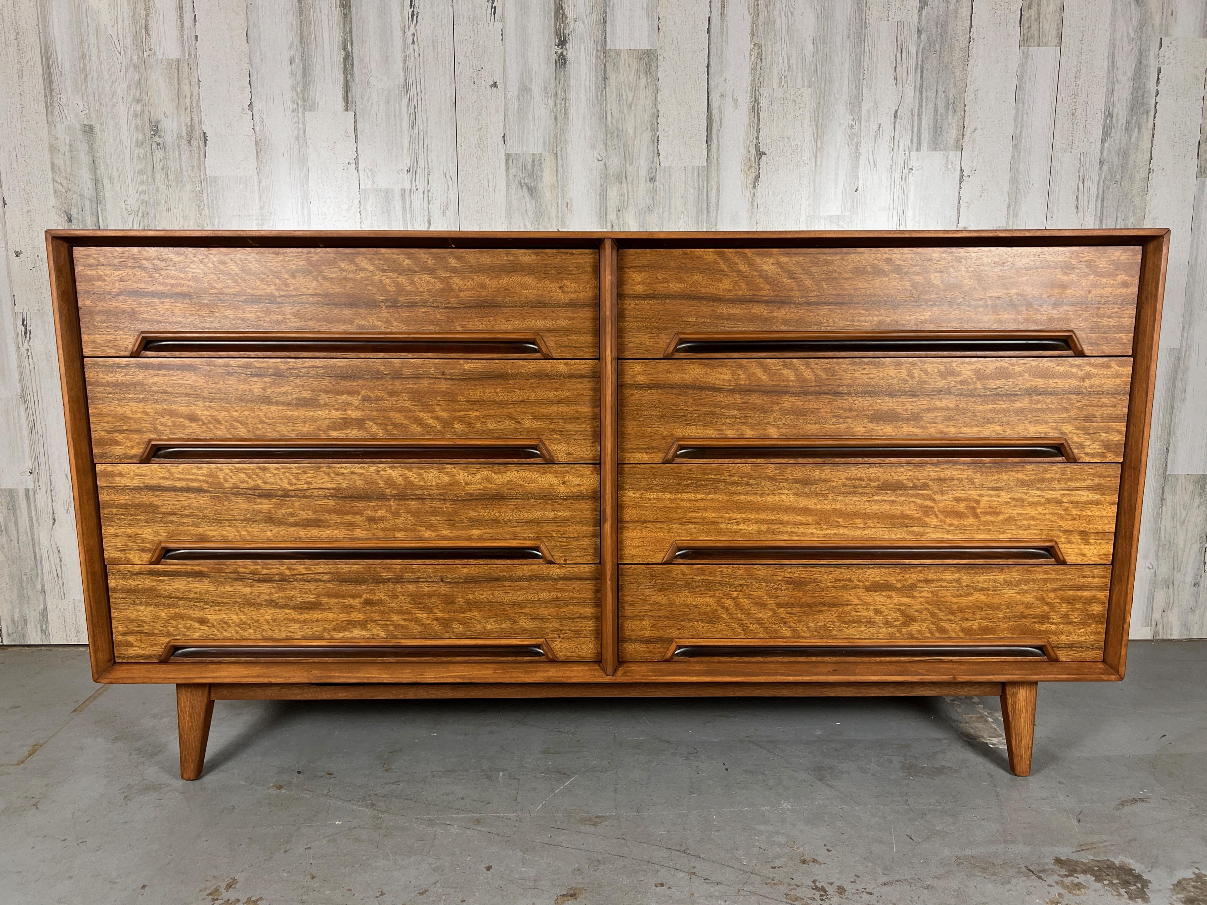 Mahogany eight drawer dresser designed by Milo Baughman for Drexel.
The legs pictured are vintage but not the original.