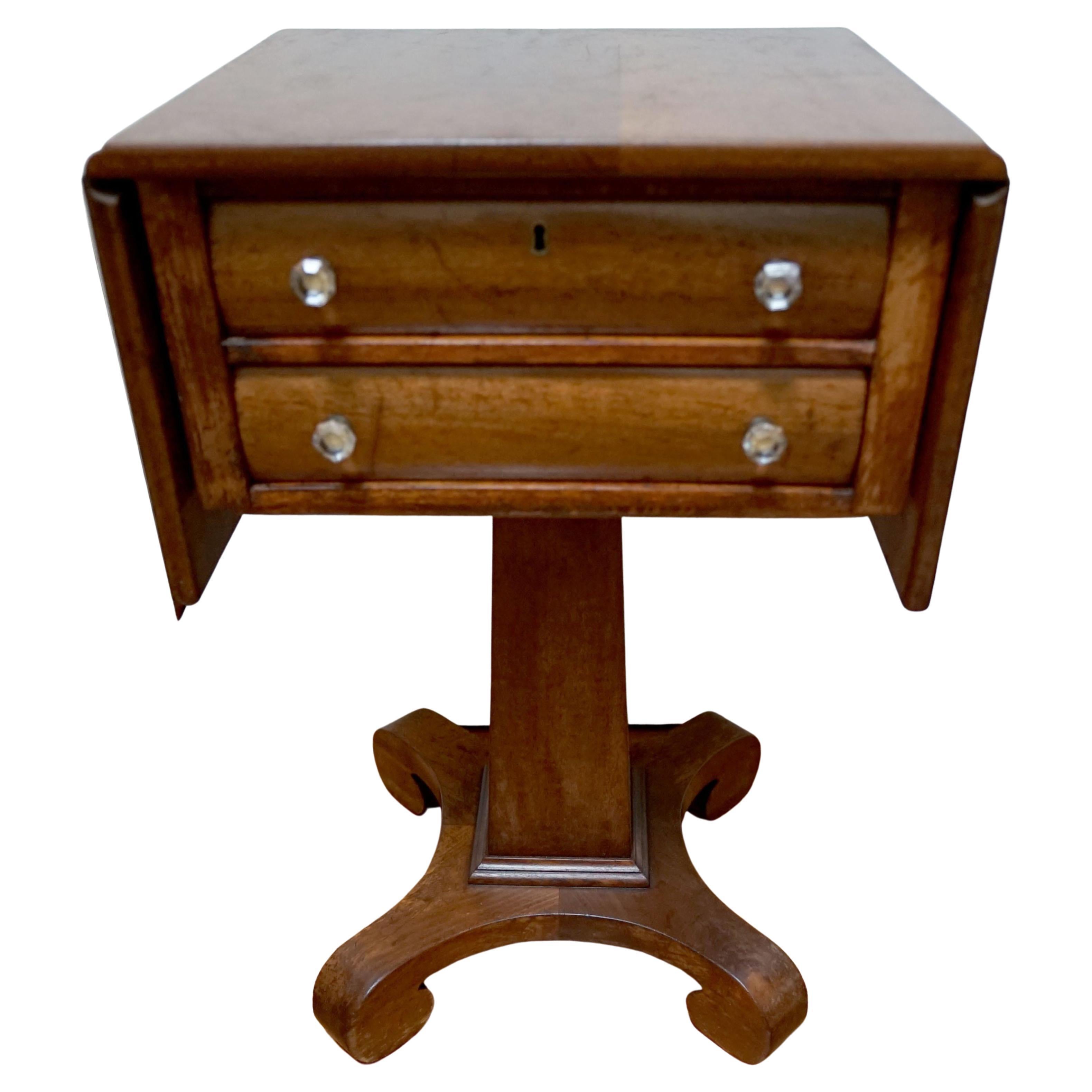 An American Empire mahogany drop-leaf worktable ready for light tasks or to function as a beautiful piece.
Appraisers say it was probably produced in New York from 1825 to 1835. Designers will love deciding how to pair this vintage item with more