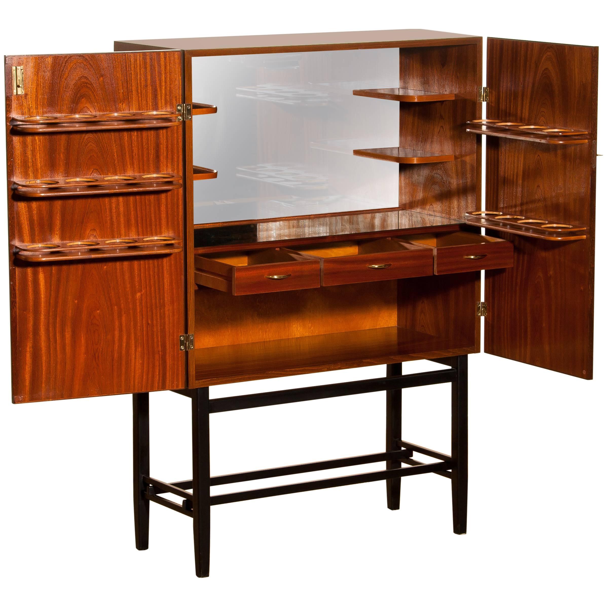 Mahogany Dry Bar Cabinet, Brass Details, High Black Skinny Legs Made by Förenade