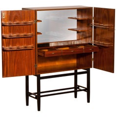 Mahogany Dry Bar Cabinet, Brass Details, High Black Skinny Legs Made by Förenade