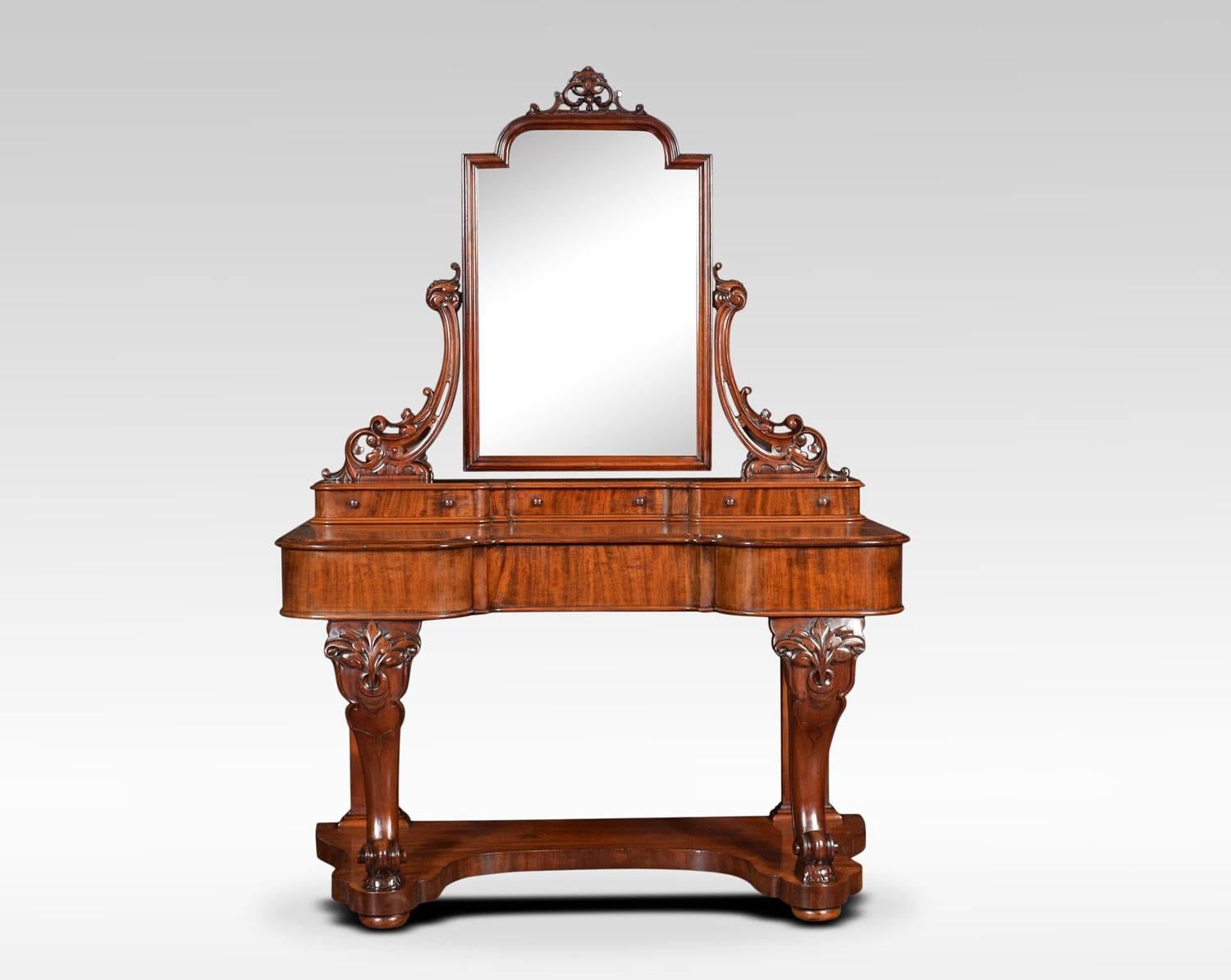 Mahogany Duchess dressing table, the original mirror plate in moulded frame between carved supports. Over three short drawers. To the base with large mahogany top above single short freeze draw. All raised up on carved cabriole front supports united