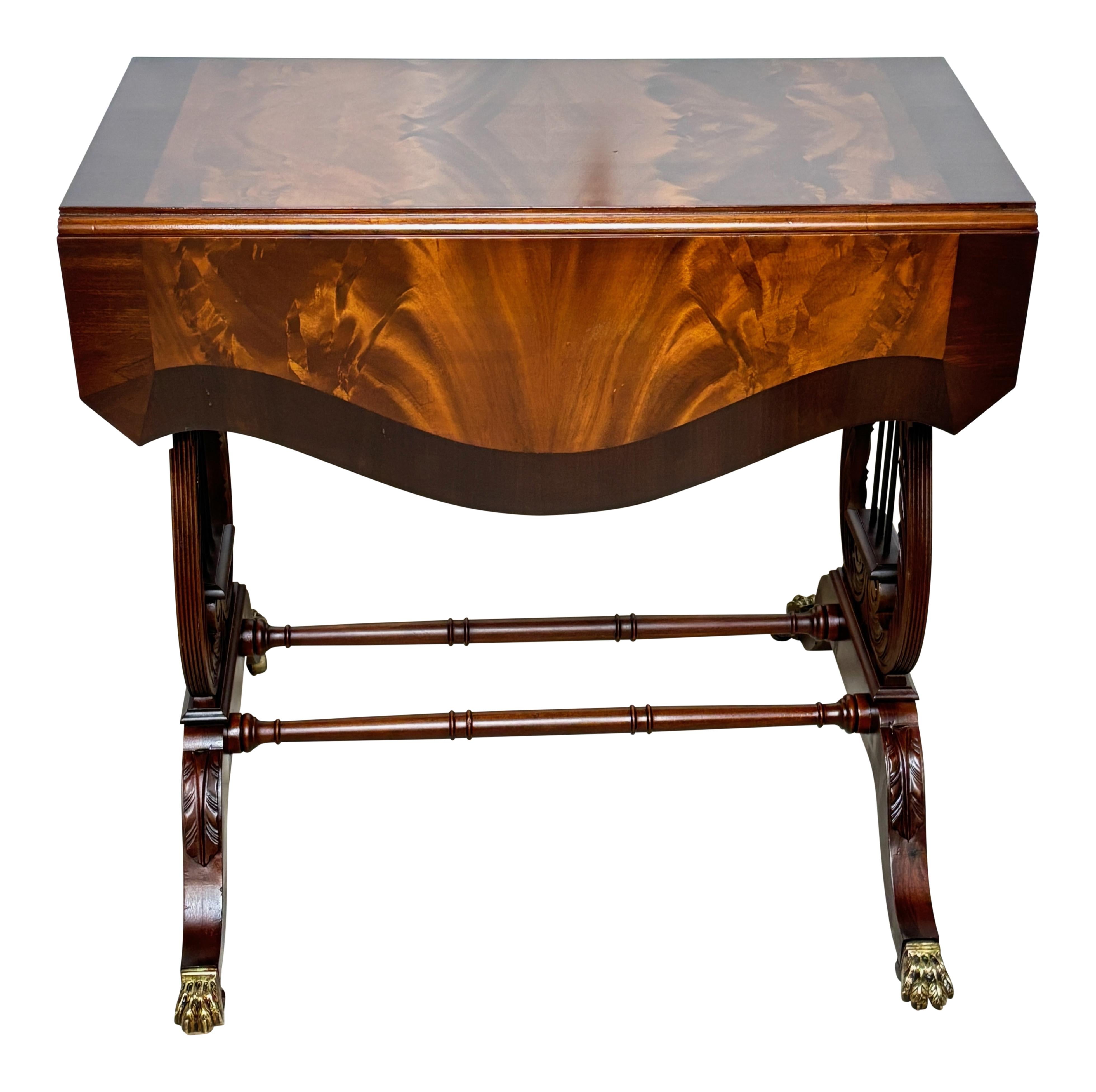 Solid mahogany Duncan Phyfe style drop leaf table with matchbook crotch mahogany veneers.
Excellent condition and quality, recently refinished.
When open the table measures 35.5 wide x 30 deep x 29.5 high.
American, circa 1940.