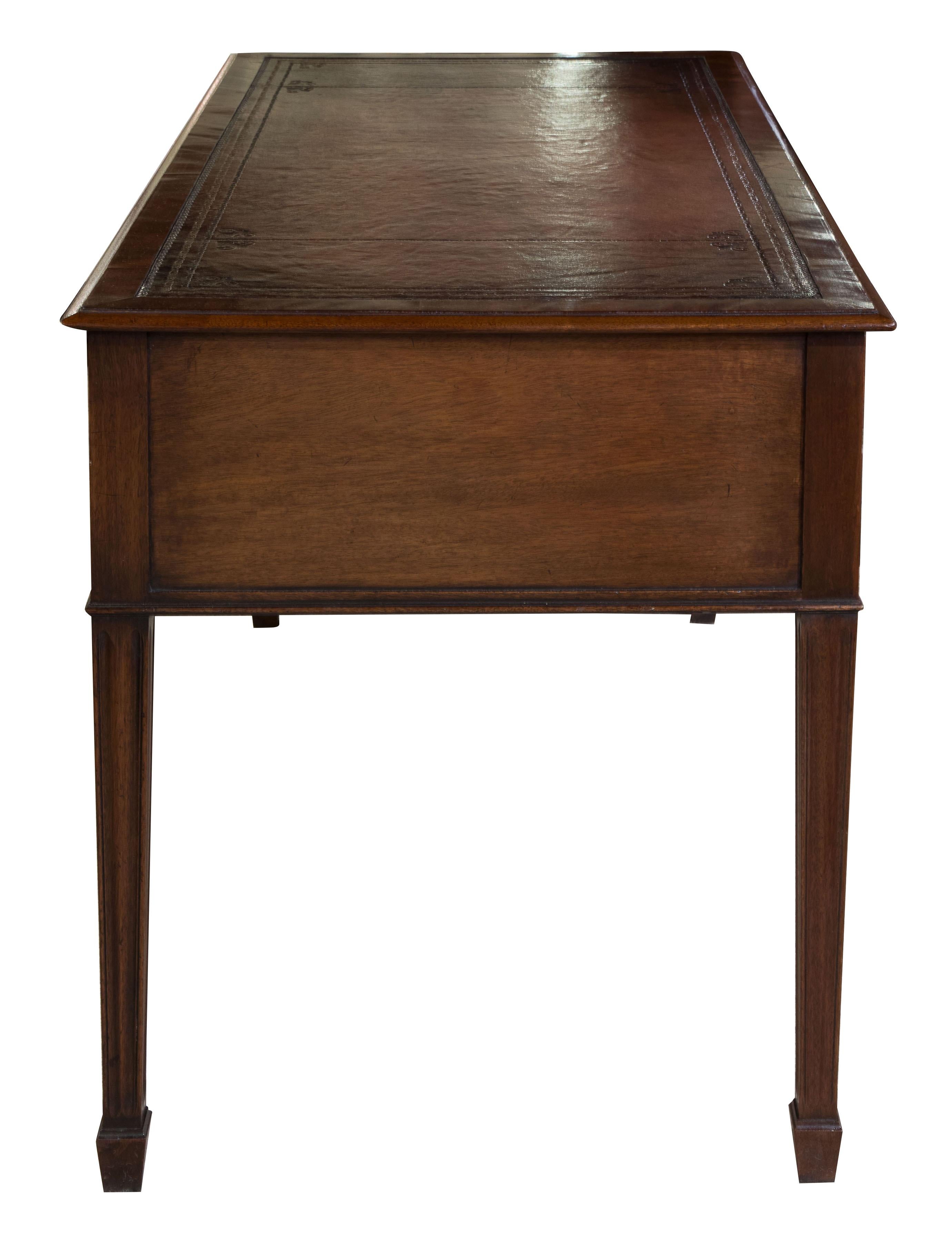 Good quality mahogany five-drawer writing table with antique wine leather top,
 

circa 1900.
         