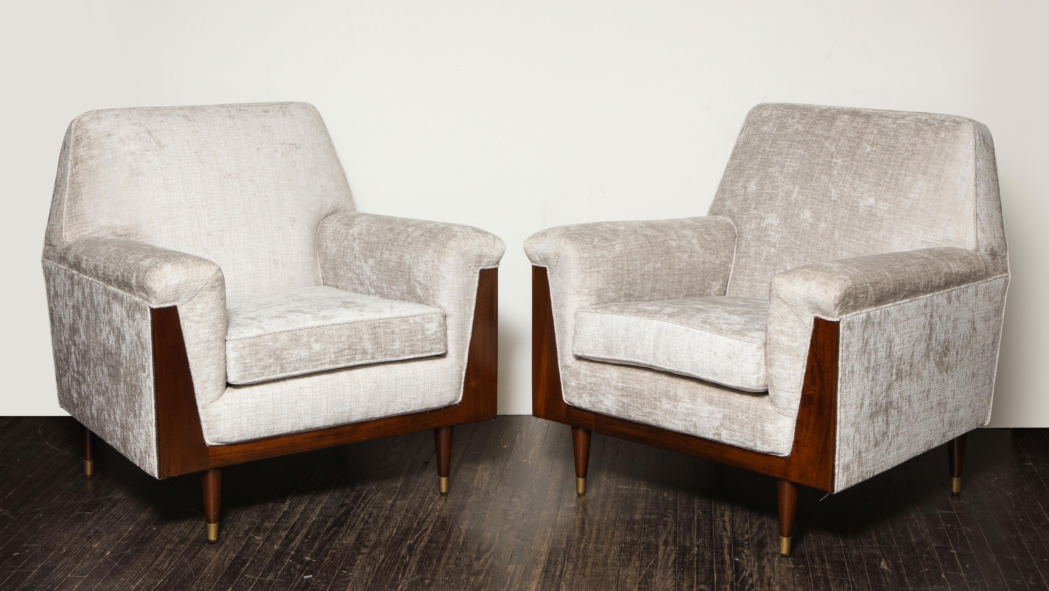 Pair of off white velvet armchair with mahogany frame detail and brass leg.