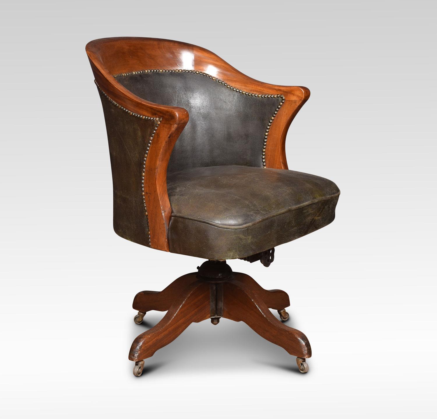 Mahogany framed adjustable swivel office chair the raised back above upholstered green leather seat and arms the chair retaining its original leather. Raised up on four splayed legs terminating in original castors
Dimensions:
Height 34 inches