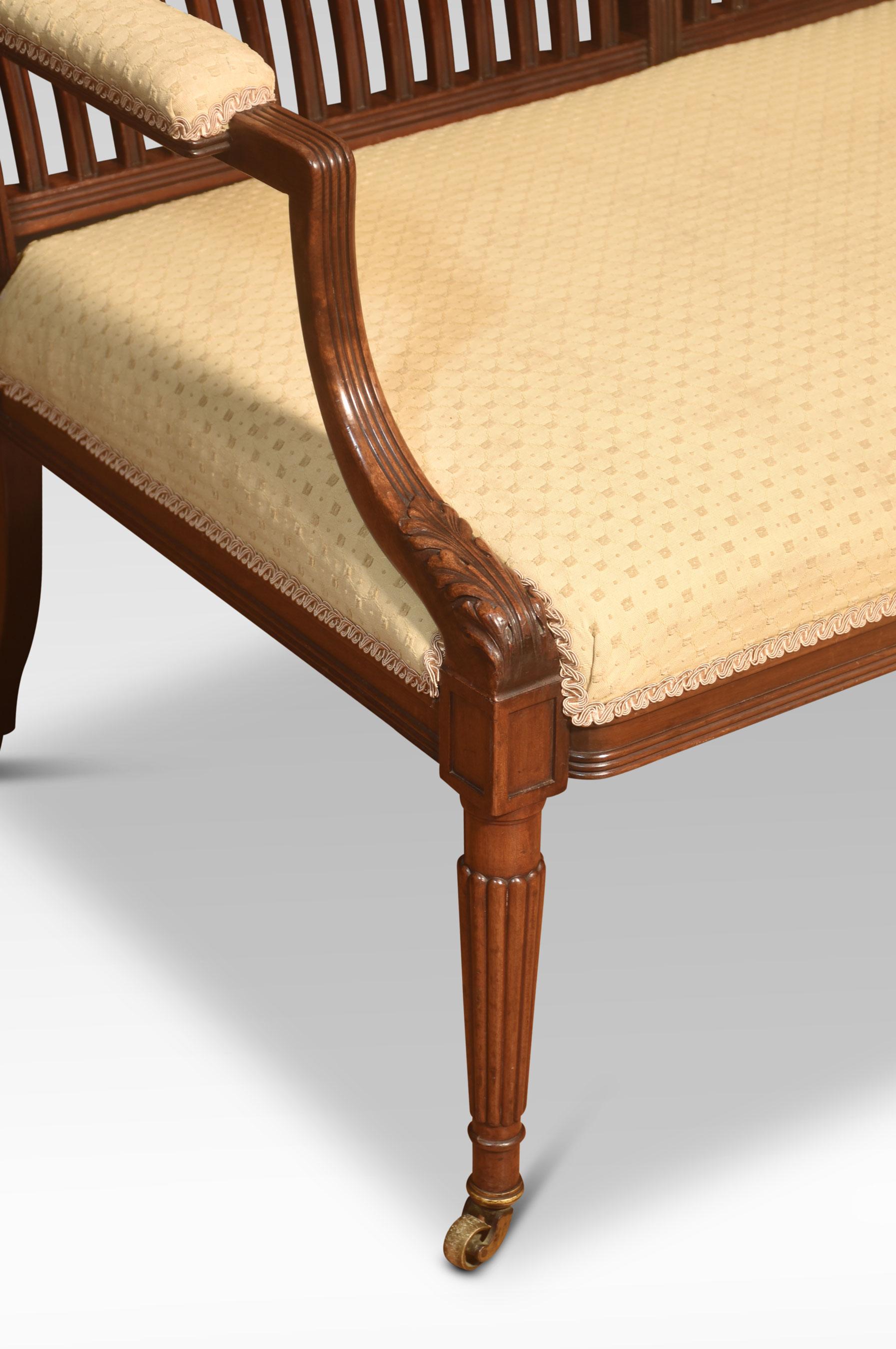 Mahogany framed settee, the rectangular slatted back with reeded moulding and acanthus carved armrests, to the overstuffed seat. All raised-up reeded tapering supports terminating in castors.
Dimensions
Height 34 Inches height to seat 18