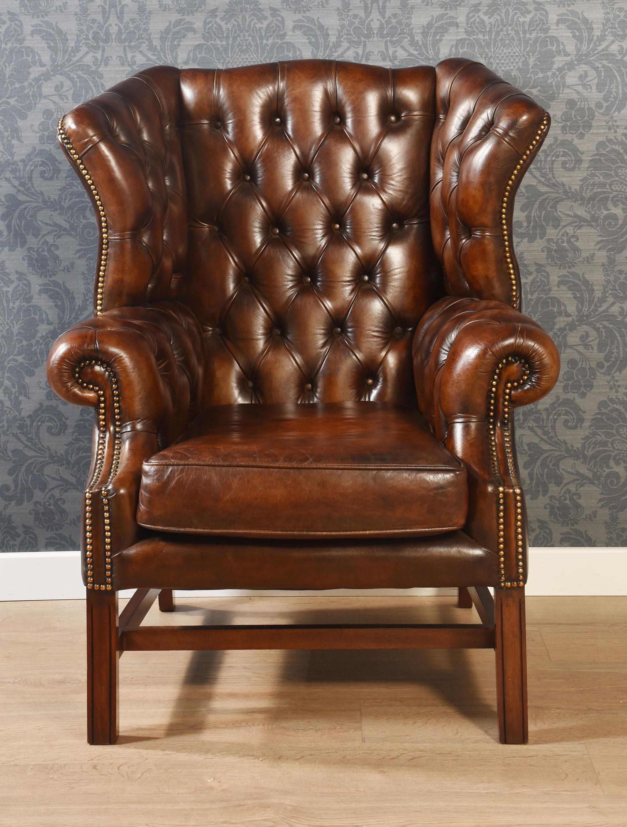Mahogany framed wing armchair of generous proportions, the arched top above deep buttoned back, upholstered arms, and seat in brown leather. All raised up on square supports united by a stretcher
Dimensions
Height 43 Inches height to seat 19