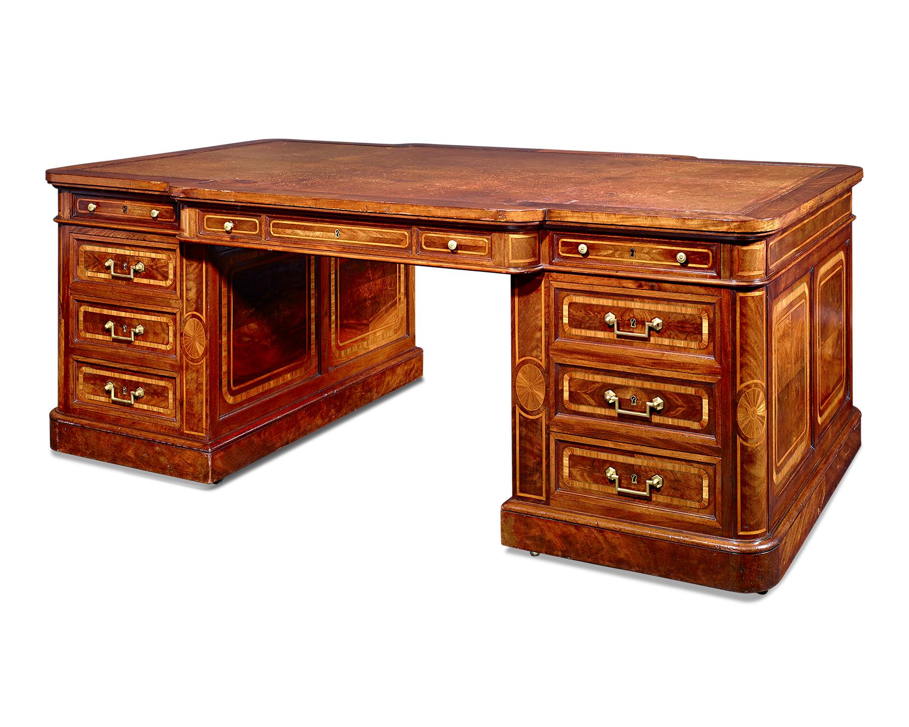 Conducting business was surely a pleasure at this imposing French partner's desk. Crafted of mahogany, the impressive desk is ingeniously designed to seat business partners directly across from each other, with drawers and ample space on each side