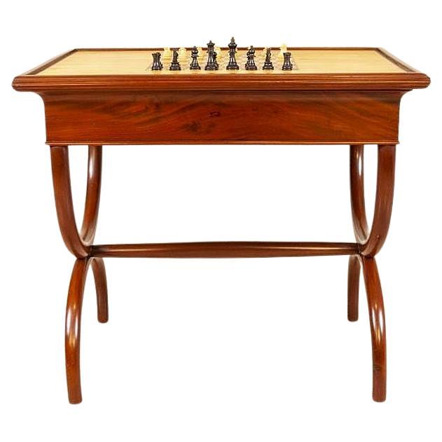 Mahogany Chess and Backgammon Table From the Turn of the 19th and 20th Centuries

We present you this elegant in its simplicity chess and backgammon table from the turn of the 19th and 20th centuries.
The two-sided table, which makes the chess