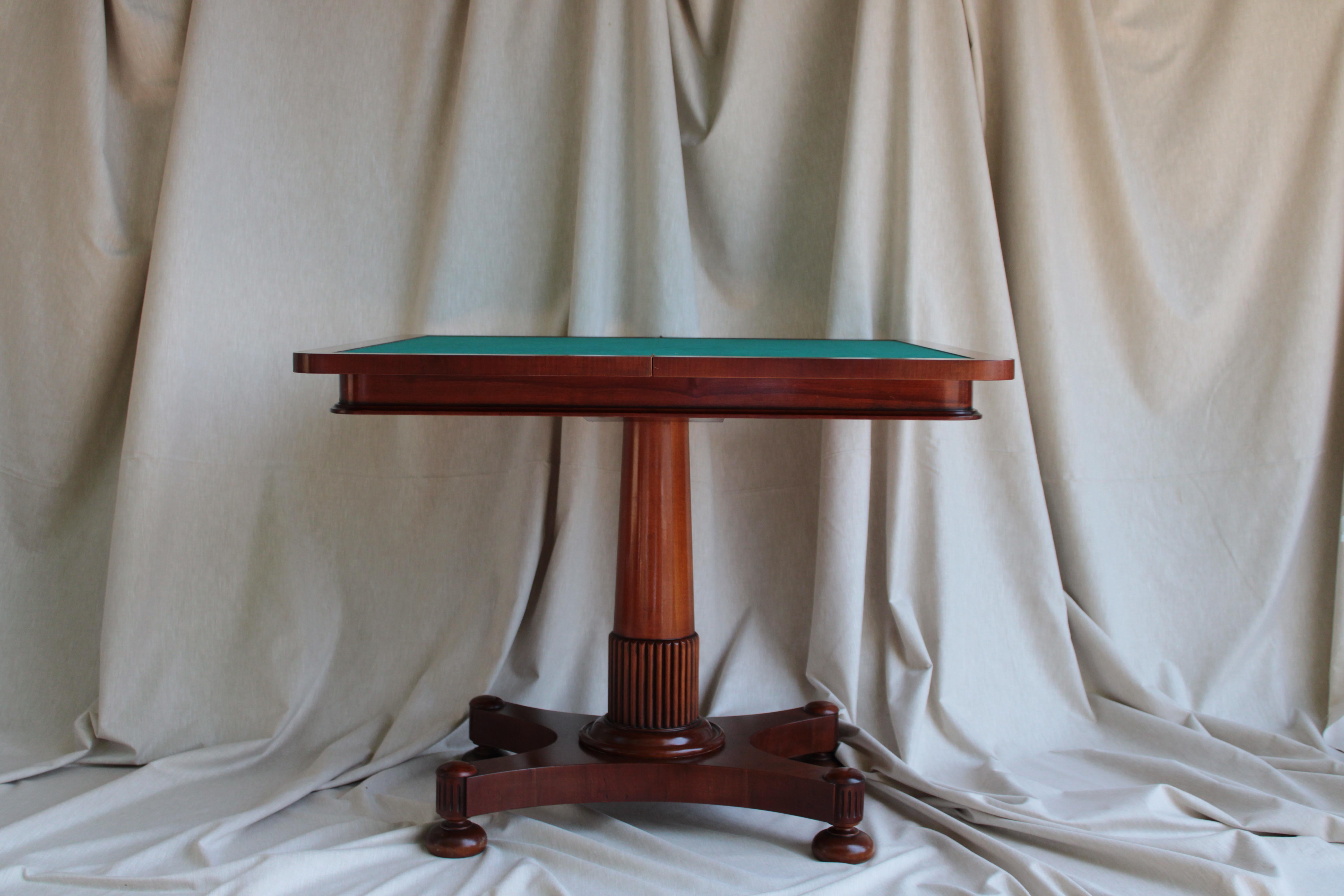 Mahogany game table from Portugal dated back to 1930s.

Portugal has a long history of fine craftsmanship, and during the 1930s, furniture styles in the country often incorporated elements of Art Deco and traditional Portuguese designs.
The use