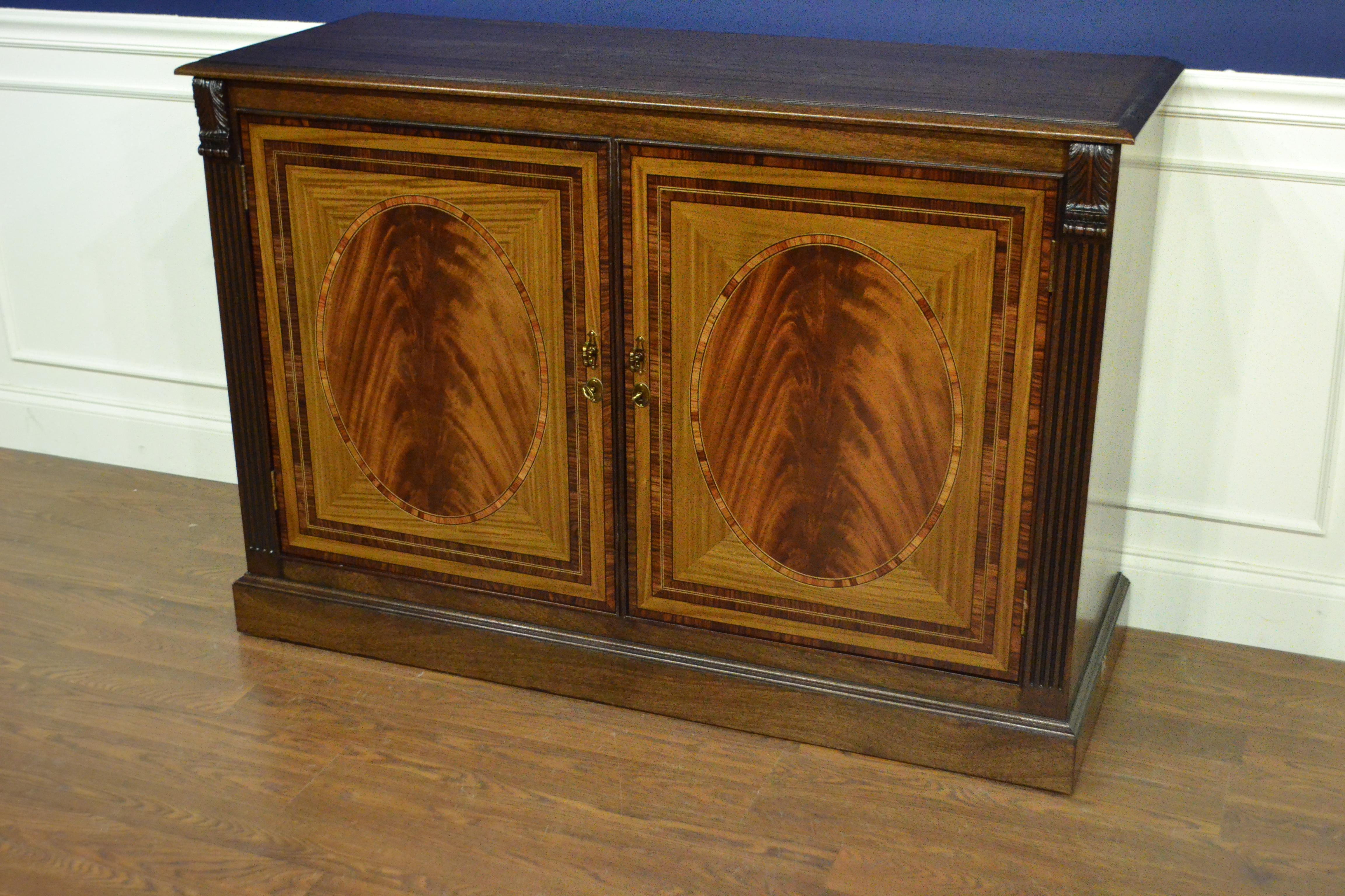 This is made-to-order traditional mahogany two-door buffet or credenza made in the Leighton Hall shop. It features two doors with swirly crotch mahogany fields and satinwood and santos rosewood borders. It has a cathedral mahogany top with a