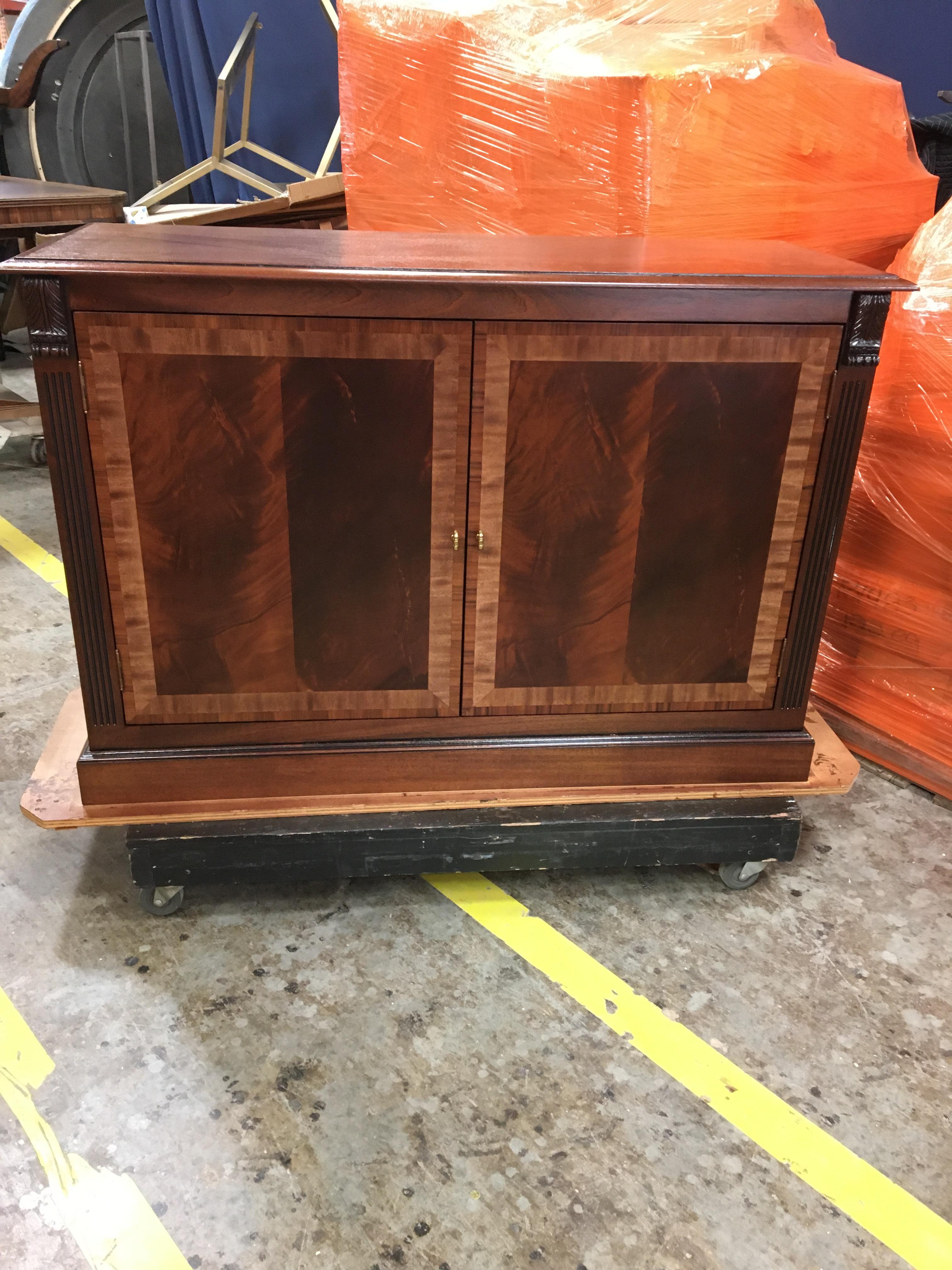 This is made-to-order traditional mahogany two-door buffet/leaf storage cabinet made in the Leighton Hall shop. It can be used as a buffet or it can be configured for dining table leaf storage. This cabinet features two doors with reverse slip