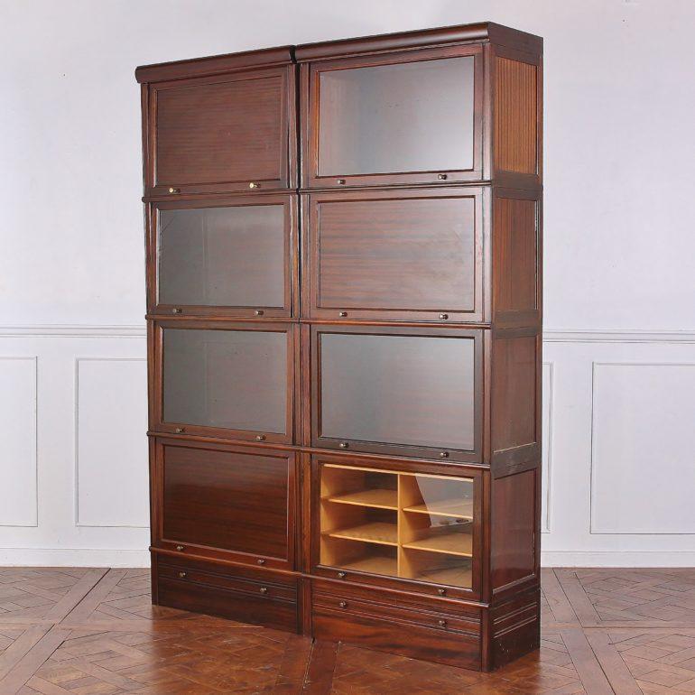 A set of eight French, mahogany, vintage haberdashery or bookcase modular units, including glass-front display cabinets and wooden-front storage. The sections may be interchanged into whatever arrangement suits the user.