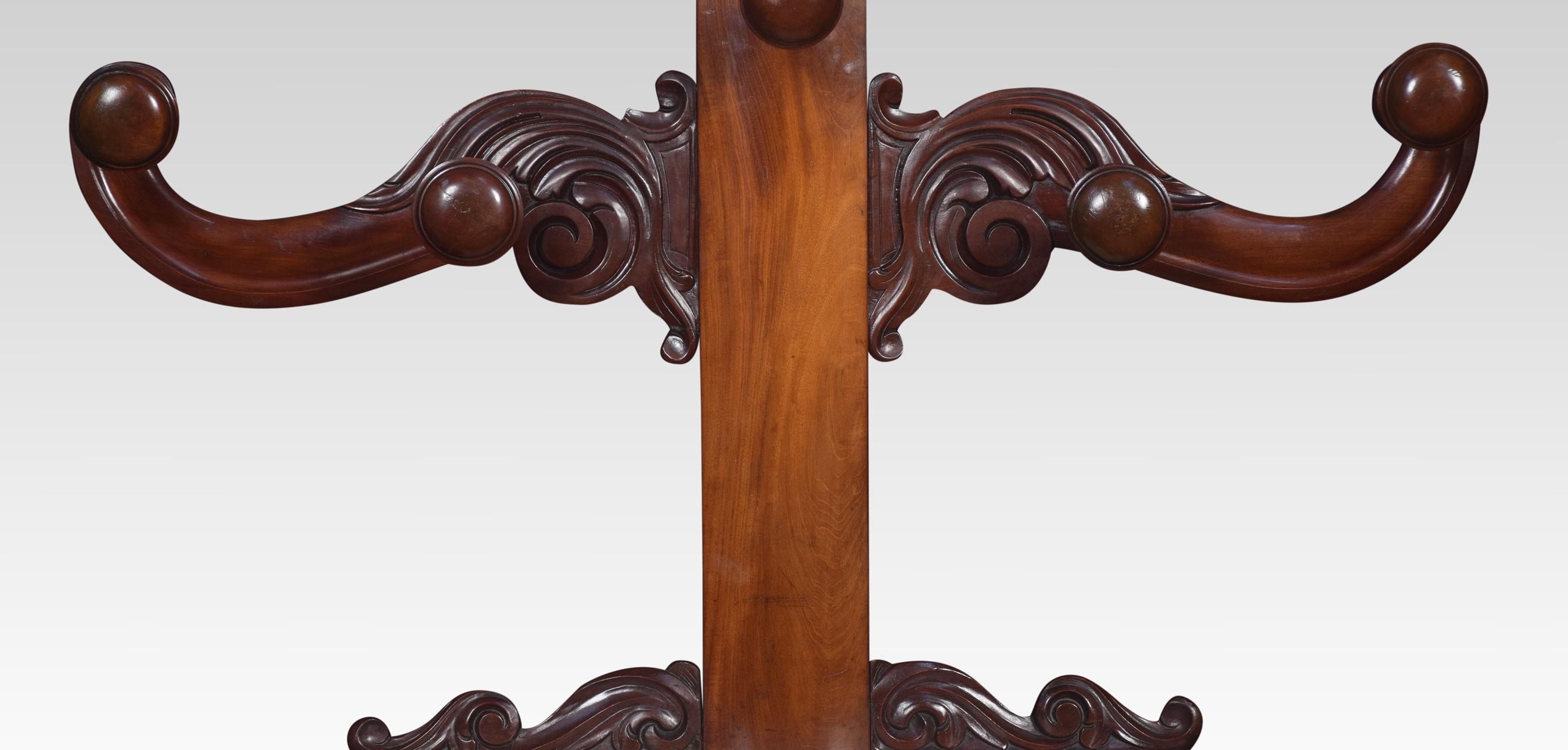 Mahogany “Tree of Life” hall stand, the molded upright with two turned coat hooks headed by a scrolling carved plume, flanked by four conforming C scroll arms with eight further hooks, the lower section with a white veined marble flanked by curved