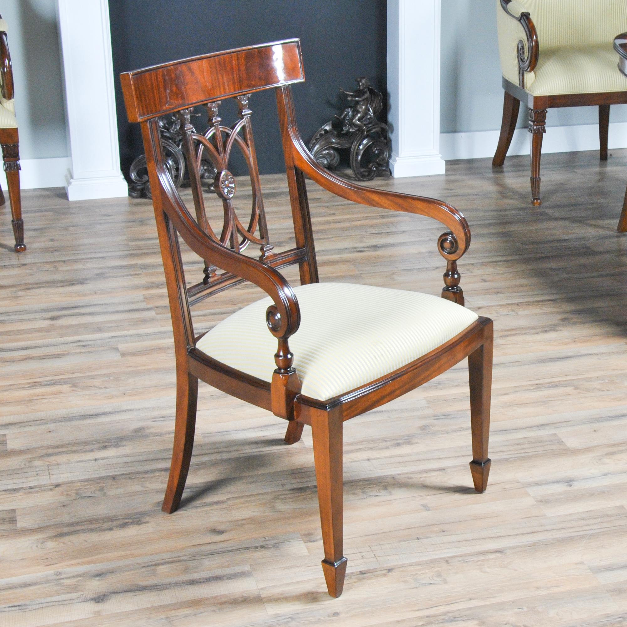 These Mahogany Hepplewhite Chairs, comprise of a set with 2 arm chairs and eight side chairs. They are a high quality dining chair with enough hand carved detail in the back for them to stand apart from mass produced counterparts. These chairs have